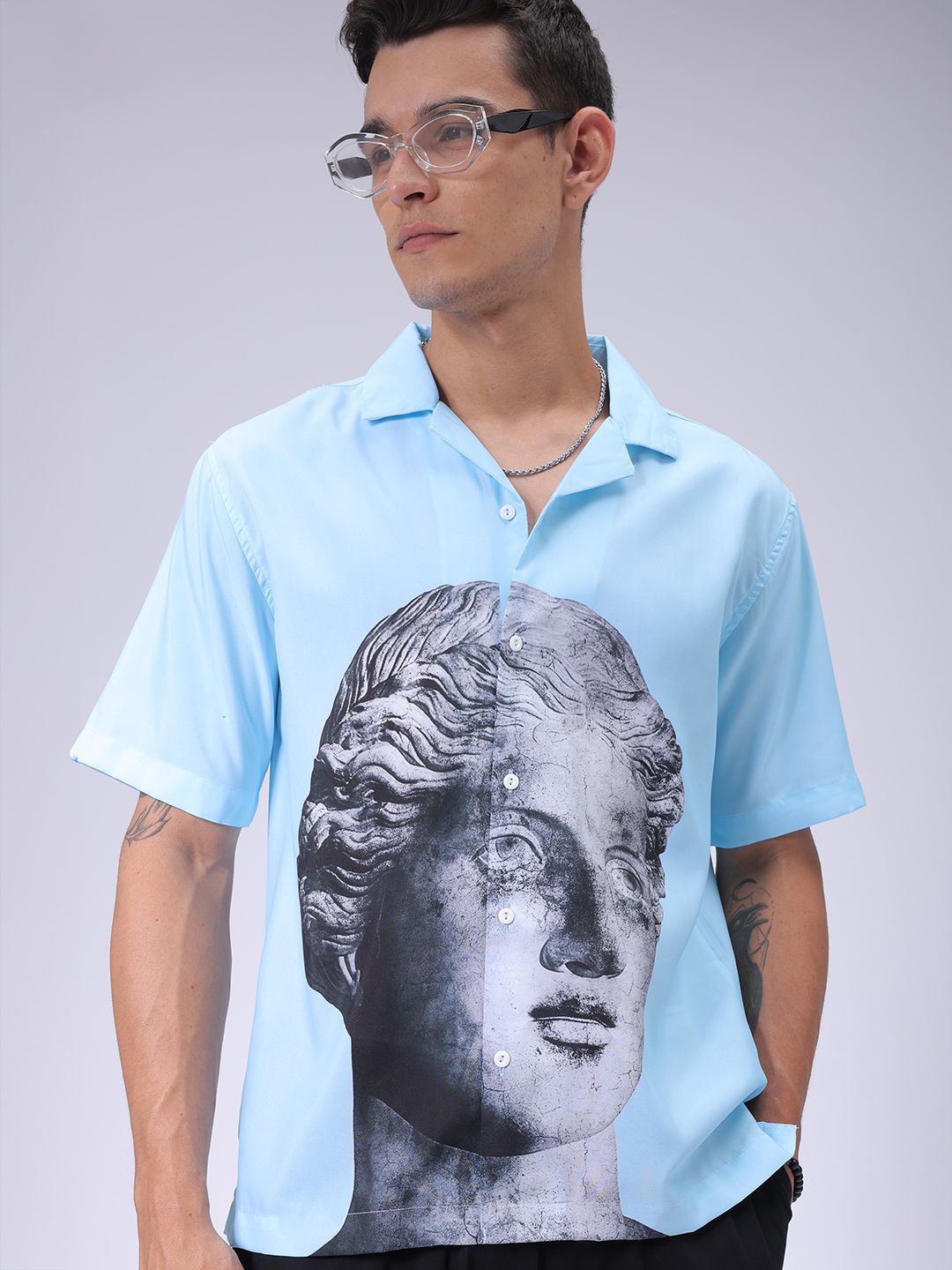 The Indian Garage Co Men Cuban Collar Graphic Printed Oversized Resortwear Shirt, Blue
The Indian Garage Co Men Cuban Collar Graphic Printed Oversized Resortwear Shirt, Blue