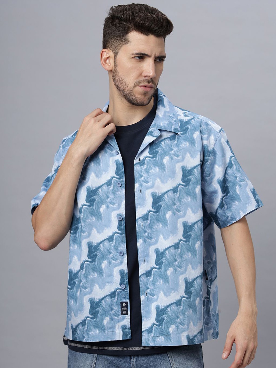 The Roadster Lifestyle Co. Men Relaxed Cuban Collar Abstract Printed Cotton Casual Shirt, Blue
The Roadster Lifestyle Co. Men Relaxed Cuban Collar Abstract Printed Cotton Casual Shirt, Blue