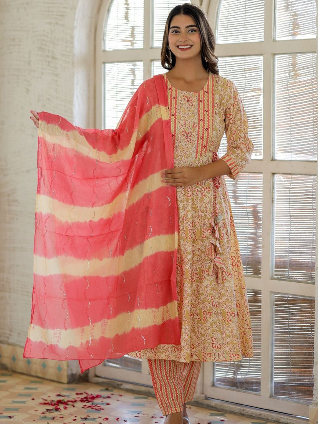 KALINI Floral Printed Regular Mirror Work Anarkali Kurta with Trousers & Dupatta, Peach
KALINI Floral Printed Regular Mirror Work Anarkali Kurta with Trousers & Dupatta, Peach