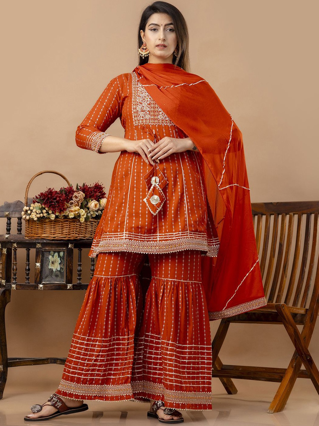Veshviti Women Floral Embroidered Empire Mirror Work Kurta with Sharara & With Dupatta, Orange
Veshviti Women Floral Embroidered Empire Mirror Work Kurta with Sharara & With Dupatta, Orange