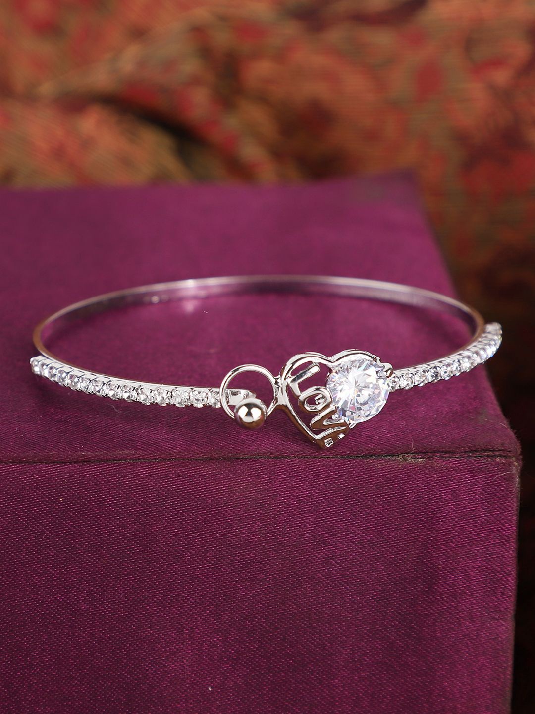 ANIKAS CREATION Silver-Plated American Diamond Studded Openable Bangle-Style Bracelet
ANIKAS CREATION Silver-Plated American Diamond Studded Openable Bangle-Style Bracelet