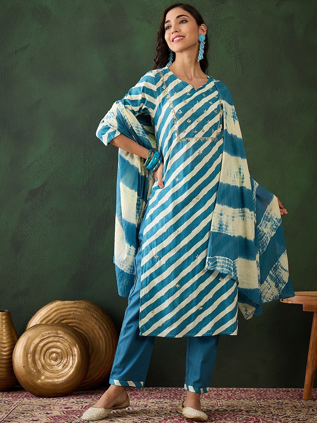 Vastramyaa Women Leheriya Striped Regular Sequinned Pure Cotton Kurta Set, Teal
Vastramyaa Women Leheriya Striped Regular Sequinned Pure Cotton Kurta Set, Teal