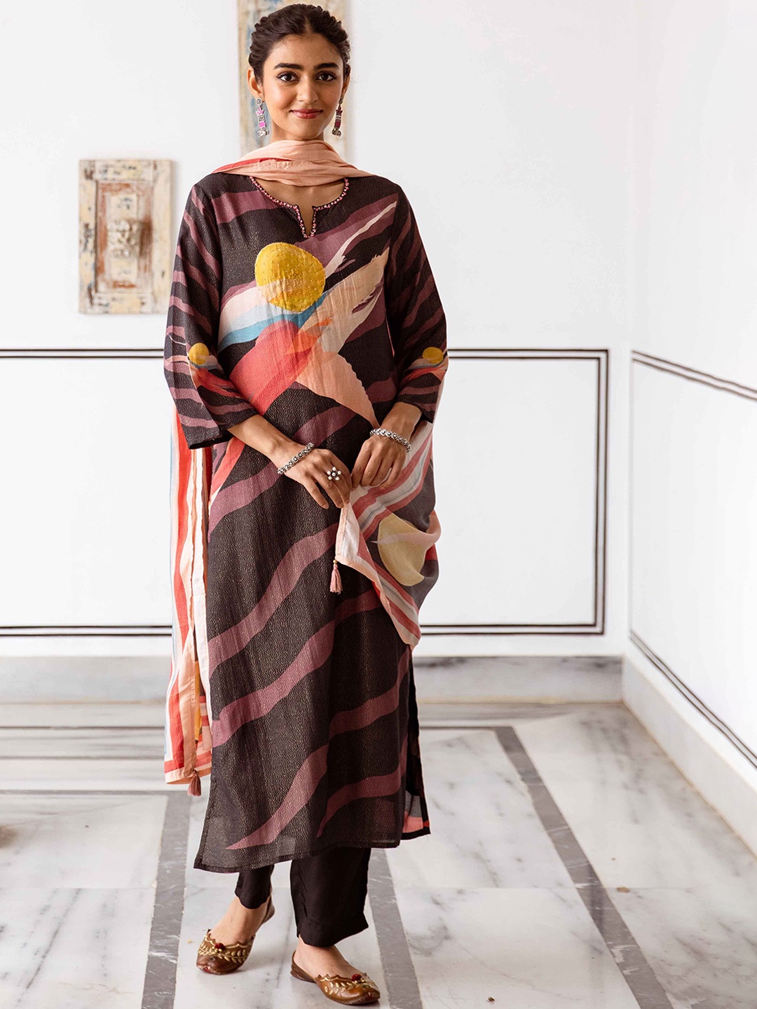 KALINI Women Printed Beads and Stones Kurta with Trousers & With Dupatta, Brown
KALINI Women Printed Beads and Stones Kurta with Trousers & With Dupatta, Brown