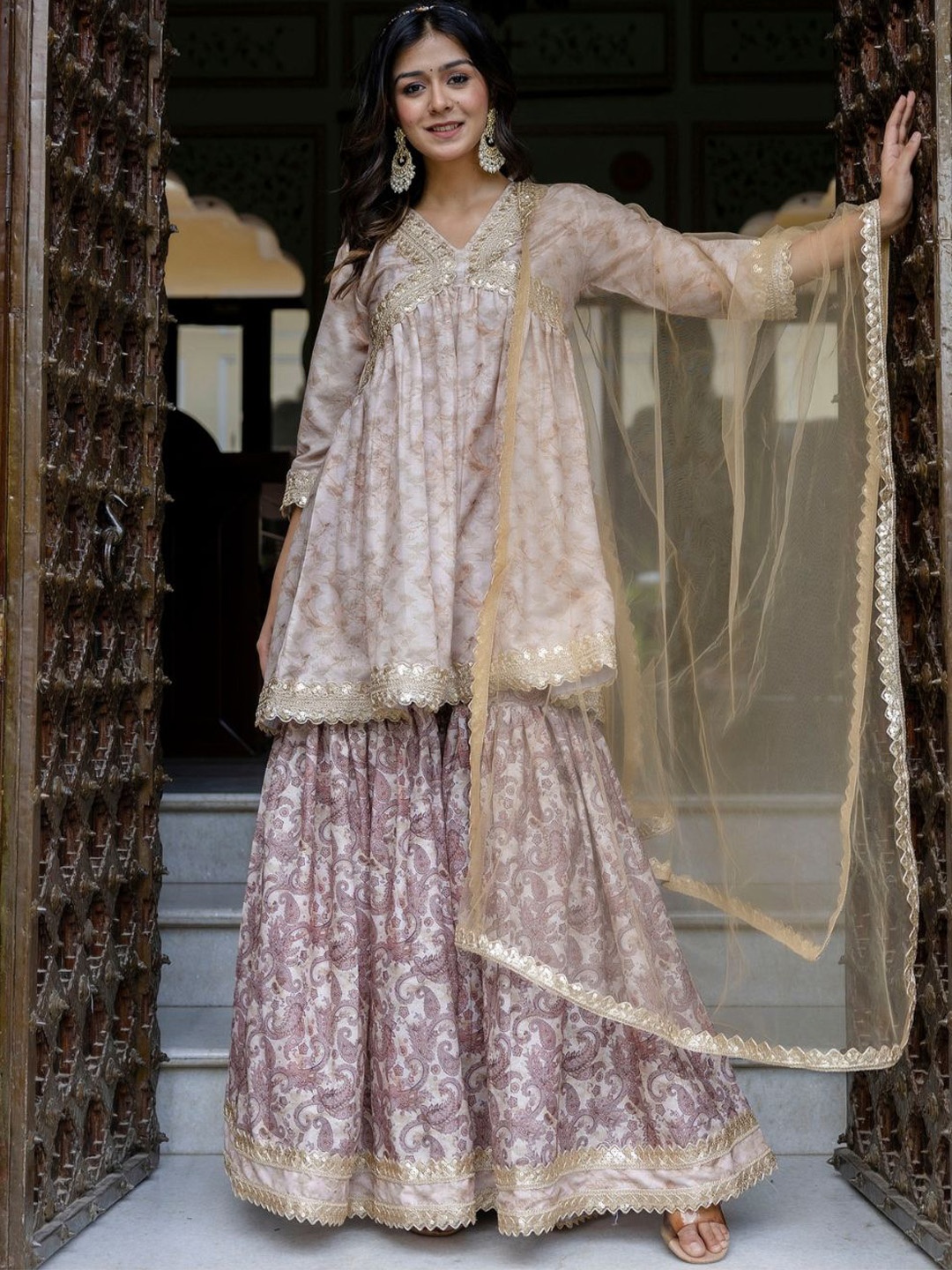 Jaipurite Women Paisley Embroidered Empire Kurta with Sharara & With Dupatta, Brown
Jaipurite Women Paisley Embroidered Empire Kurta with Sharara & With Dupatta, Brown