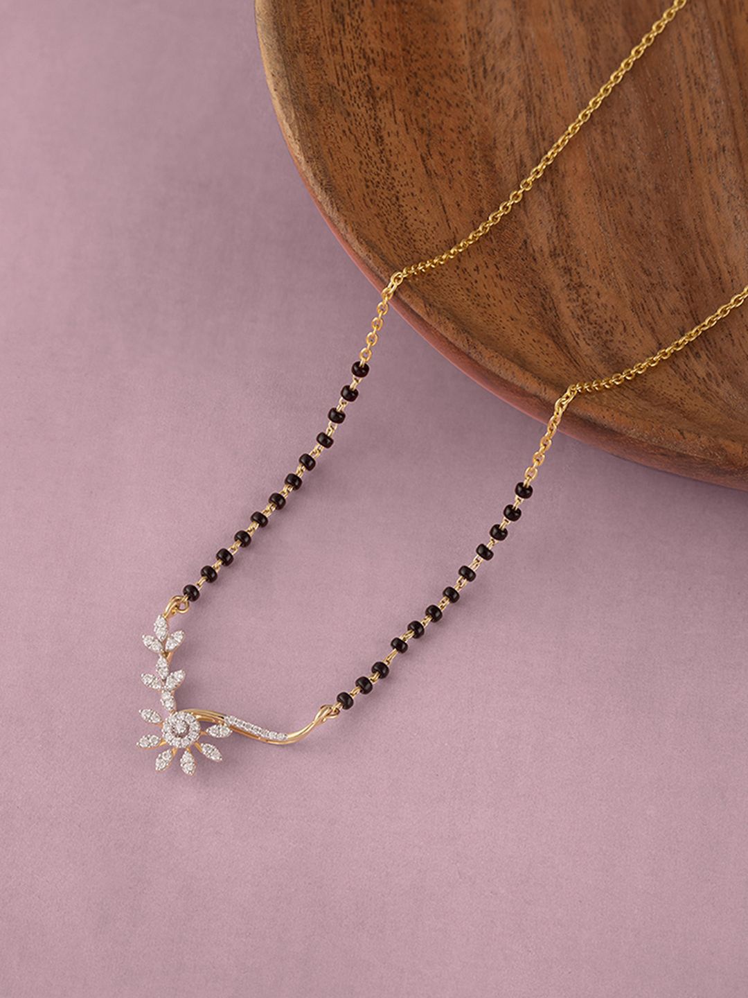 Mia by Tanishq Floral Radiance 18KT BIS Hall Mark Gold & Diamond Mangalsutra-4.92gm, Yellow
Mia by Tanishq Floral Radiance 18KT BIS Hall Mark Gold & Diamond Mangalsutra-4.92gm, Yellow