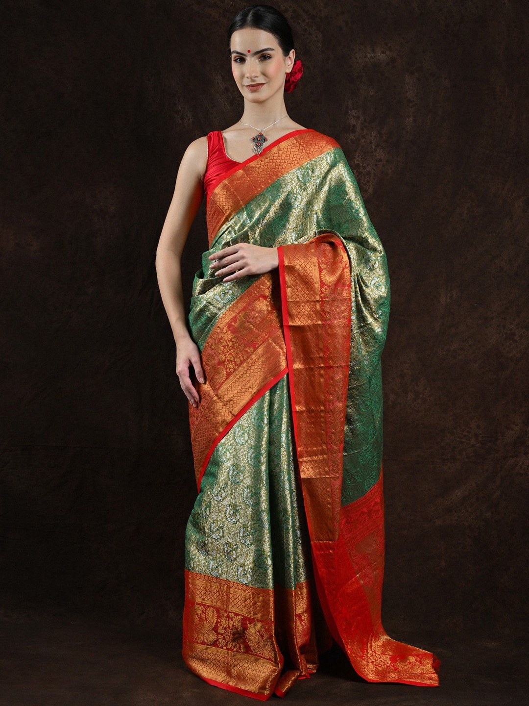 Exotic India Green Olive Zari Woven Peacock-Flower Art Silk Saree with Red Contrast Border
Exotic India Green Olive Zari Woven Peacock-Flower Art Silk Saree with Red Contrast Border