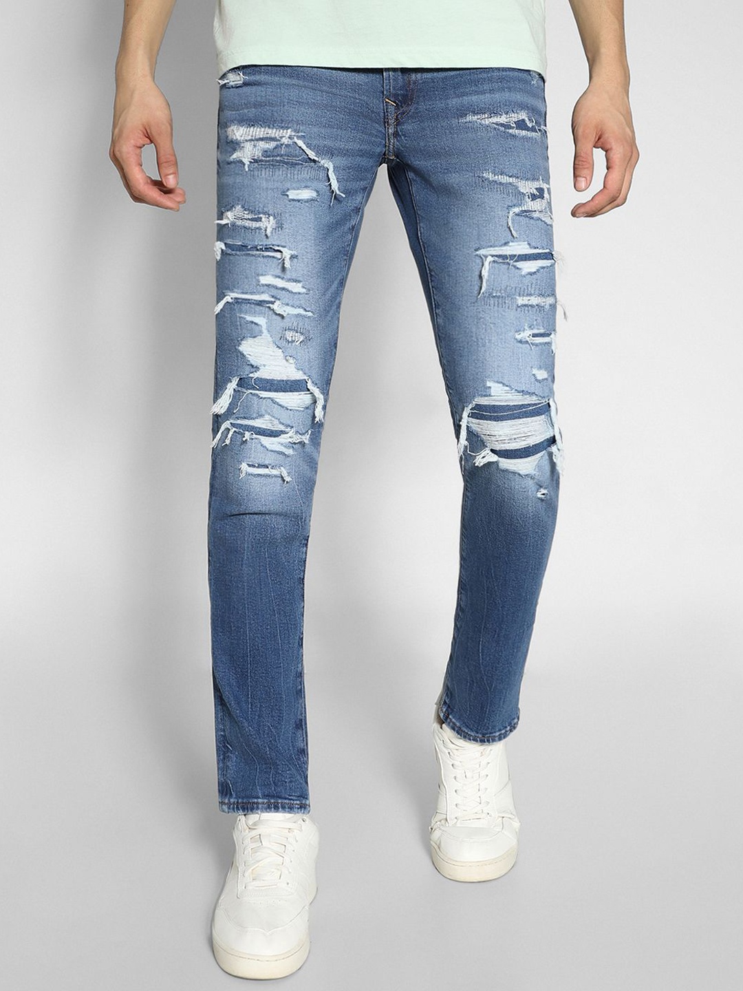 AMERICAN EAGLE OUTFITTERS Men Slim Fit Mid-Rise Heavy Fade Highly Distressed Jeans, Blue
AMERICAN EAGLE OUTFITTERS Men Slim Fit Mid-Rise Heavy Fade Highly Distressed Jeans, Blue