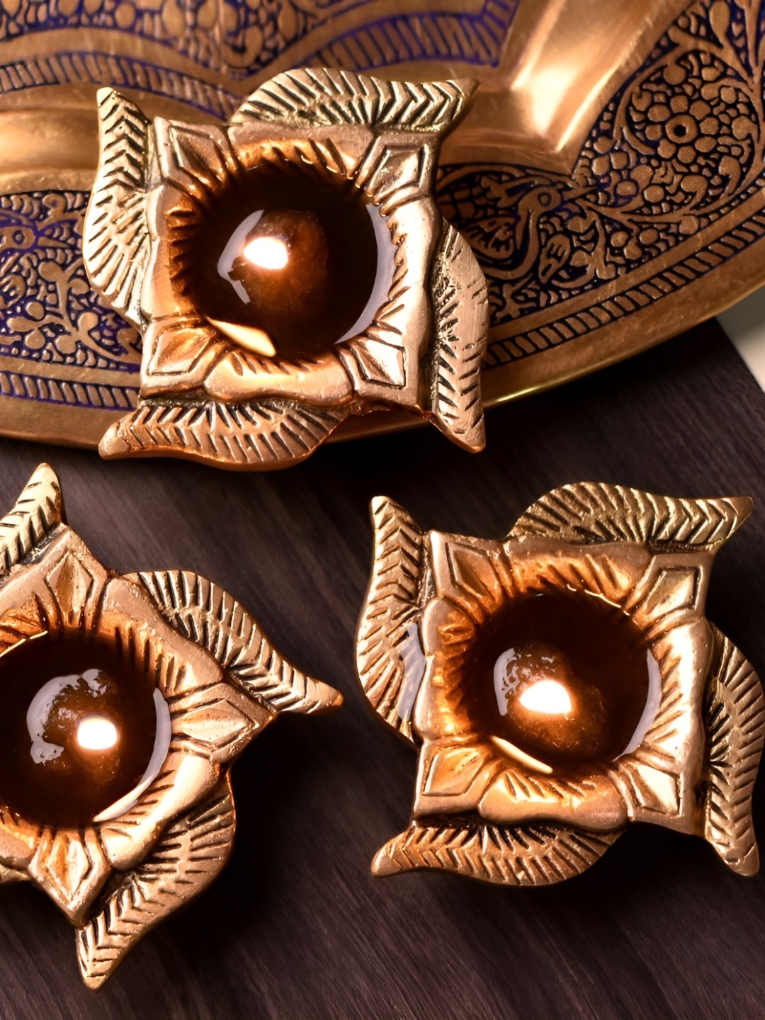 Indianshelf GoldToned and Black 3 Pieces Textured Brass Swastik Elegant Deepak Diyas, Gold
Indianshelf GoldToned and Black 3 Pieces Textured Brass Swastik Elegant Deepak Diyas, Gold