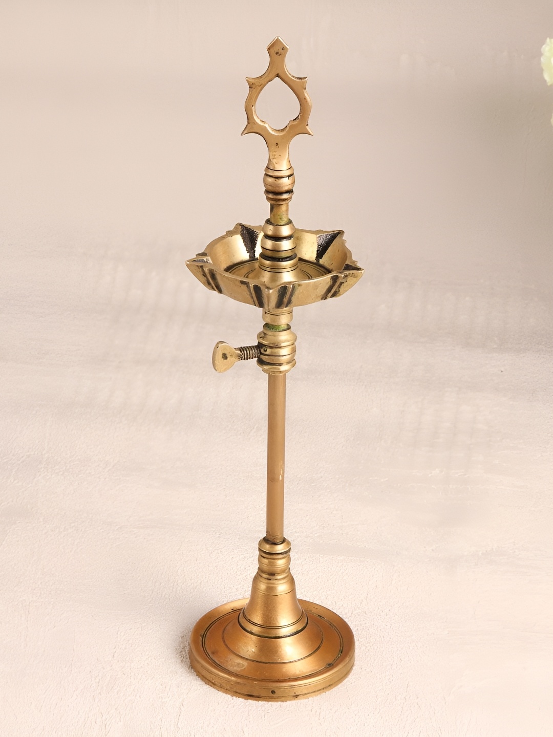 Indianshelf GoldToned and Black Brass Textured Pooja Adjustable Standing Diya, Gold
Indianshelf GoldToned and Black Brass Textured Pooja Adjustable Standing Diya, Gold