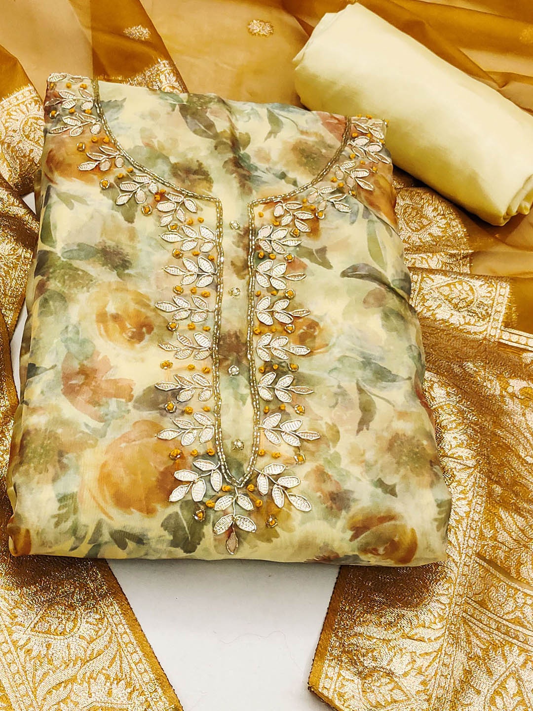 Ishin Floral Embroidered Beads and Stones Detail Organza Unstitched Dress Material, Mustard
Ishin Floral Embroidered Beads and Stones Detail Organza Unstitched Dress Material, Mustard