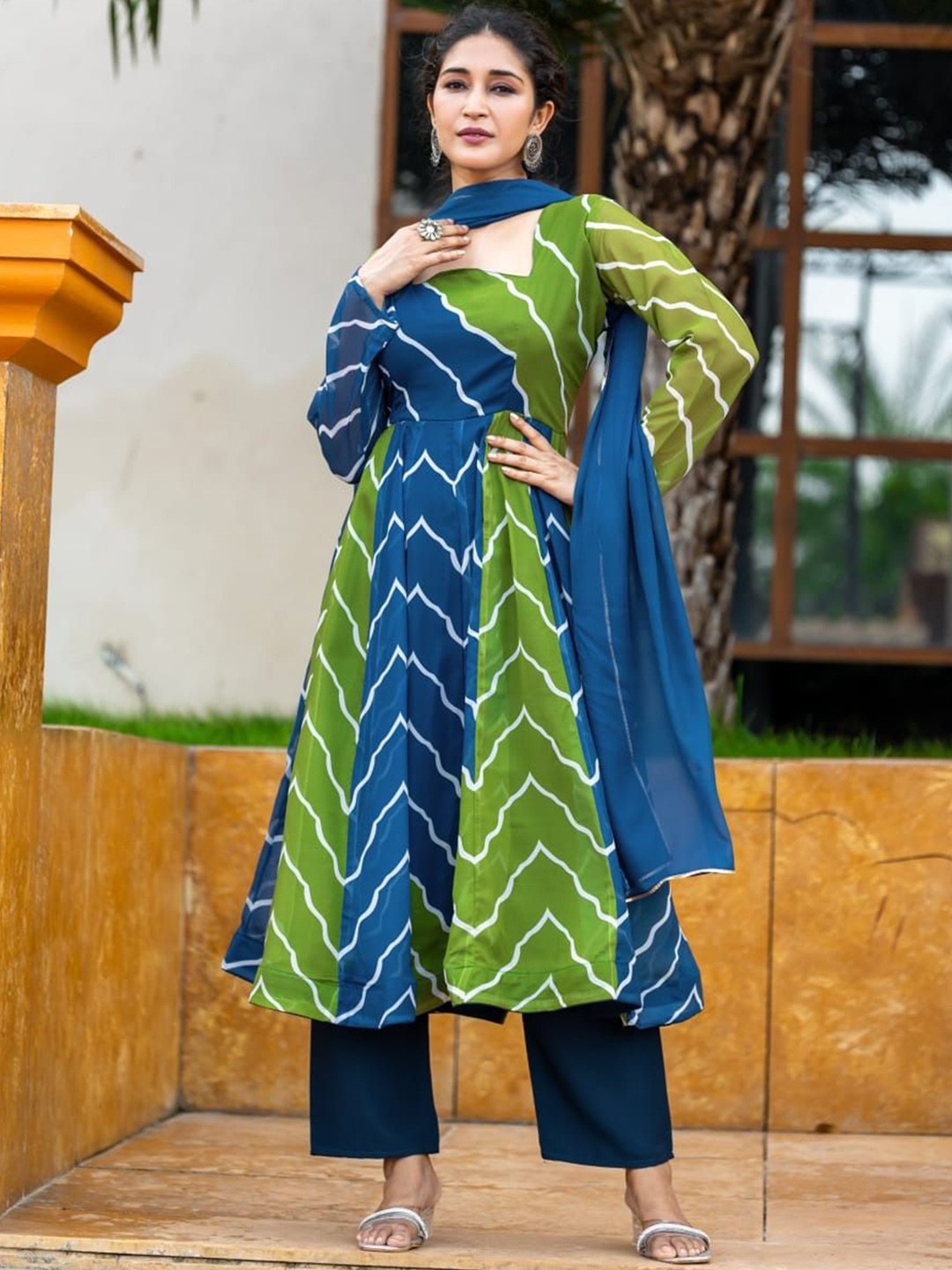 Shriji fashion Leheriya Printed Georgette Anarkali Kurta With Trousers & Dupatta, Green
Shriji fashion Leheriya Printed Georgette Anarkali Kurta With Trousers & Dupatta, Green