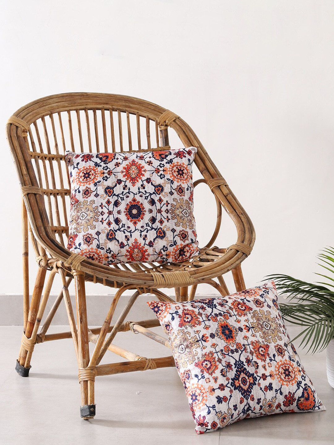 HANDICRAFT PALACE White & Orange Set of 2 Ethnic Motifs Velvet Square Cushion Covers 
HANDICRAFT PALACE White & Orange Set of 2 Ethnic Motifs Velvet Square Cushion Covers