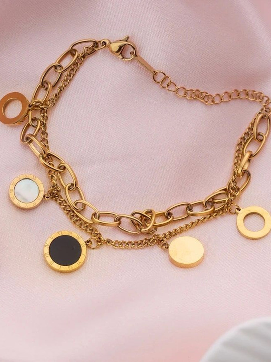 Zabby Allen Roman Stainless Steel Gold-Plated Artificial Stones Studded Charm Bracelet
Zabby Allen Roman Stainless Steel Gold-Plated Artificial Stones Studded Charm Bracelet