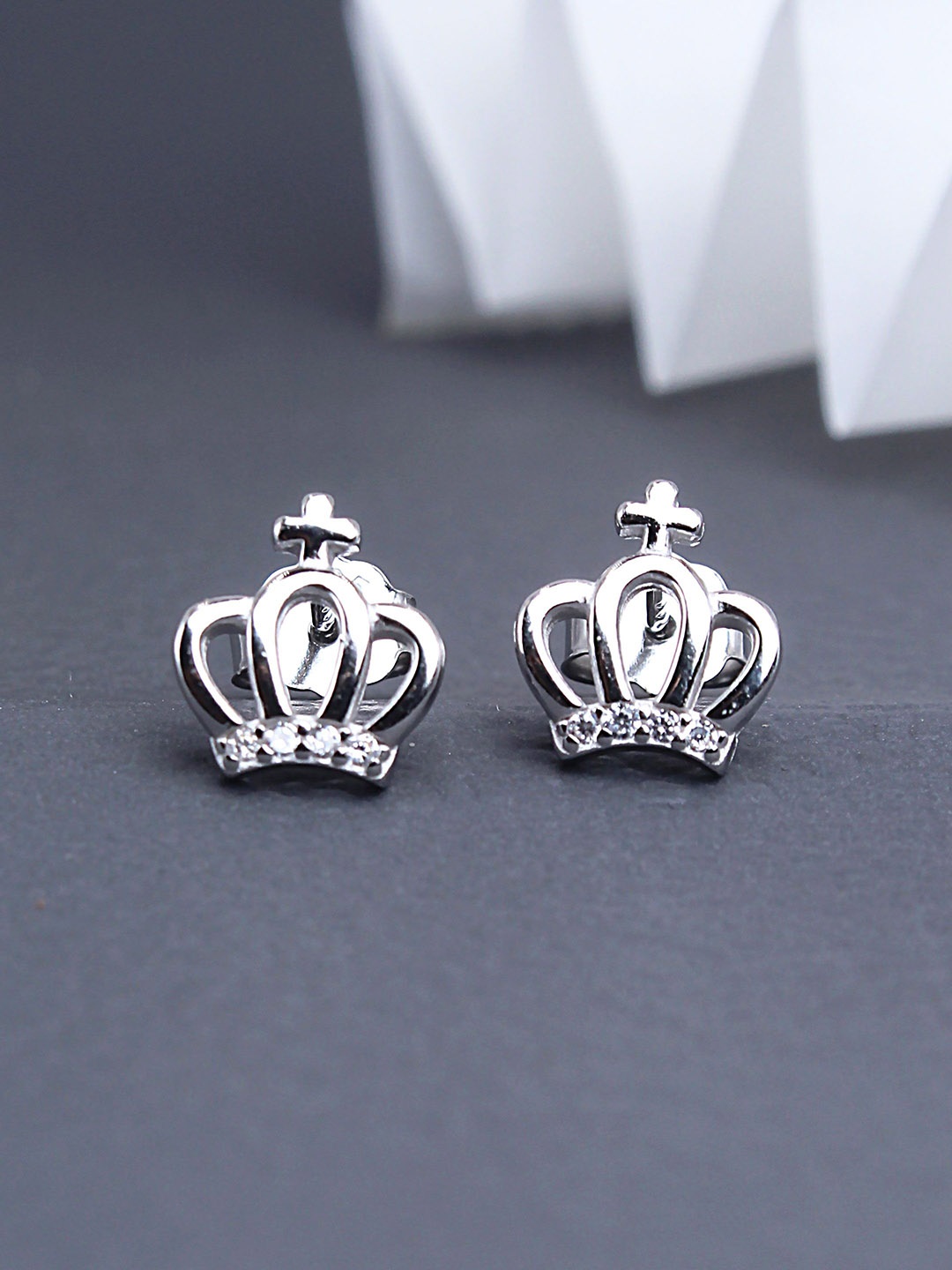 DEVASHREE 925 Sterling Silver Rhodium-Plated Cubic Zirconia Studded Crown Shaped Studs
DEVASHREE 925 Sterling Silver Rhodium-Plated Cubic Zirconia Studded Crown Shaped Studs