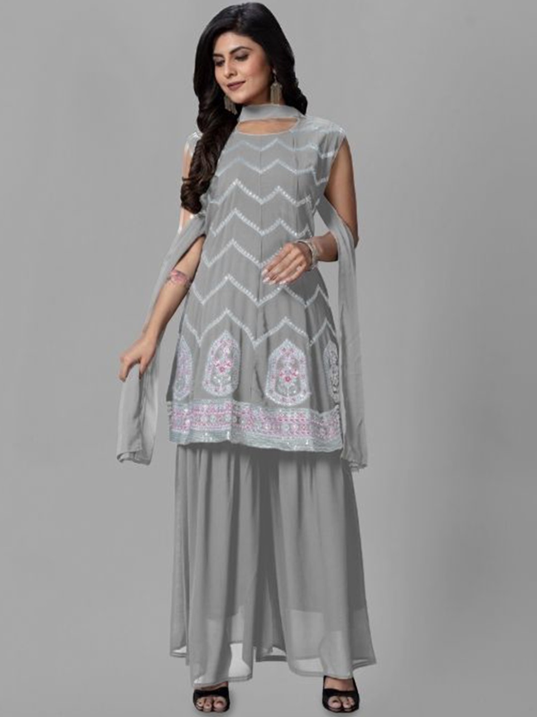 PARROT CREATION Floral Embroidered Sequinned Georgette A-Line Kurti With Sharara & Dupatta, Grey
PARROT CREATION Floral Embroidered Sequinned Georgette A-Line Kurti With Sharara & Dupatta, Grey