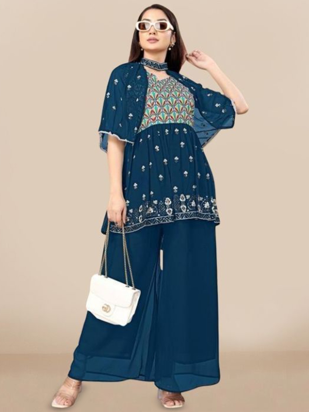 PARROT CREATION Floral Embroidered V-Neck Sequinned A-Line Kurti With Palazzo And Cape, Teal
PARROT CREATION Floral Embroidered V-Neck Sequinned A-Line Kurti With Palazzo And Cape, Teal