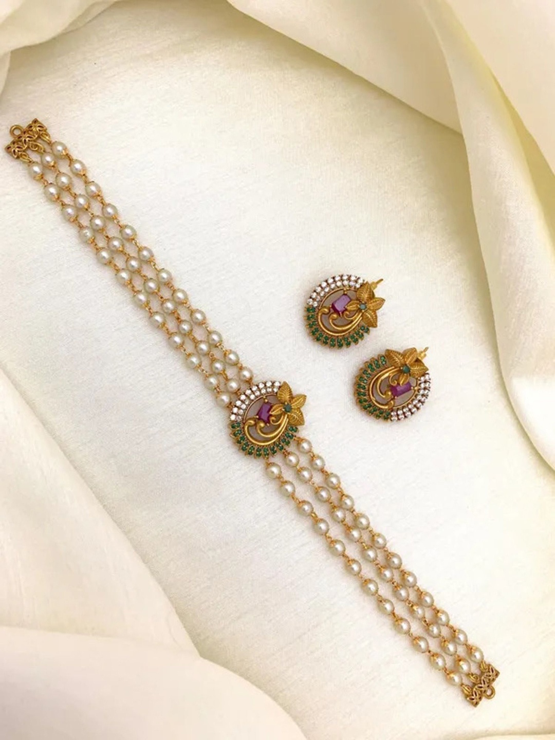 ROFARWORD Gold Plated Artificial Stones Studded And Pearls Beaded Jewellery Set
ROFARWORD Gold Plated Artificial Stones Studded And Pearls Beaded Jewellery Set