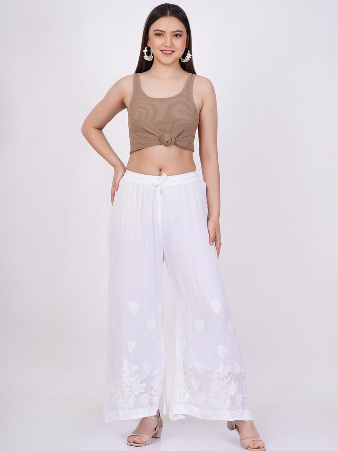 SUFIZA LIFESTYLE Women Floral Embroidered Flared Knitted Cotton Ethnic Palazzos, White
SUFIZA LIFESTYLE Women Floral Embroidered Flared Knitted Cotton Ethnic Palazzos, White