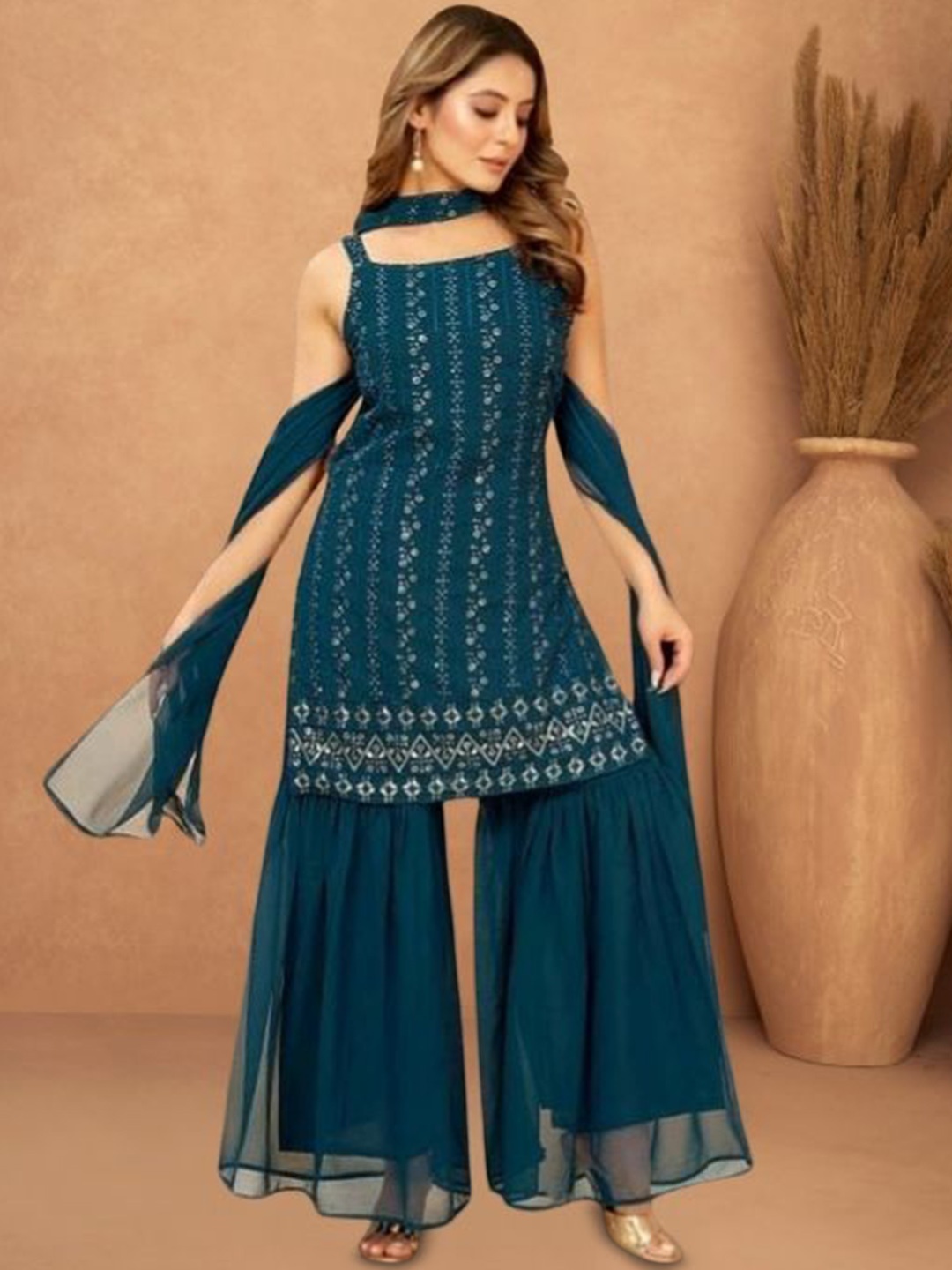 PARROT CREATION Floral Embroidered Georgette A-Line Kurti With Sharara And Dupatta, Teal
PARROT CREATION Floral Embroidered Georgette A-Line Kurti With Sharara And Dupatta, Teal