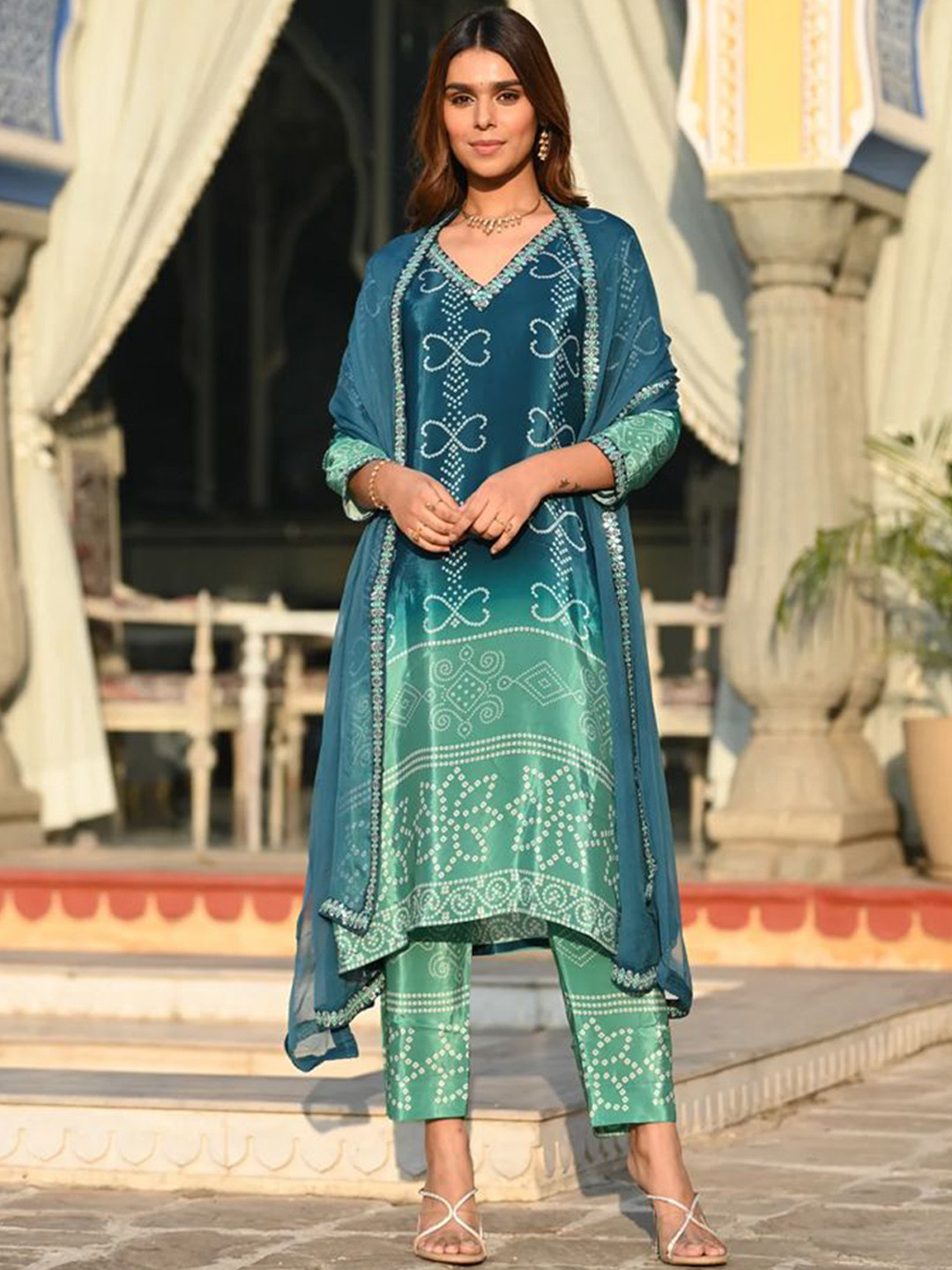 SANJANA SILK Bandhani Printed V-Neck Silk Chiffon Kurta With Trousers & Dupatta, Teal 
SANJANA SILK Bandhani Printed V-Neck Silk Chiffon Kurta With Trousers & Dupatta, Teal