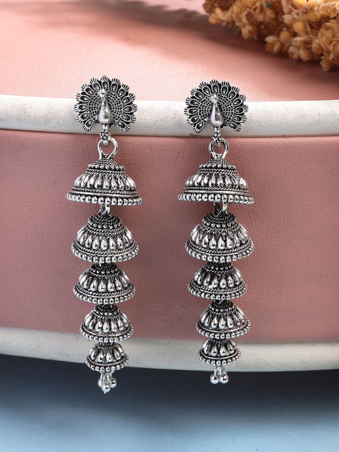 NVR Women German Silver Oxidised Silver Plated Peacock Shaped Layered Jhumka Earrings
NVR Women German Silver Oxidised Silver Plated Peacock Shaped Layered Jhumka Earrings