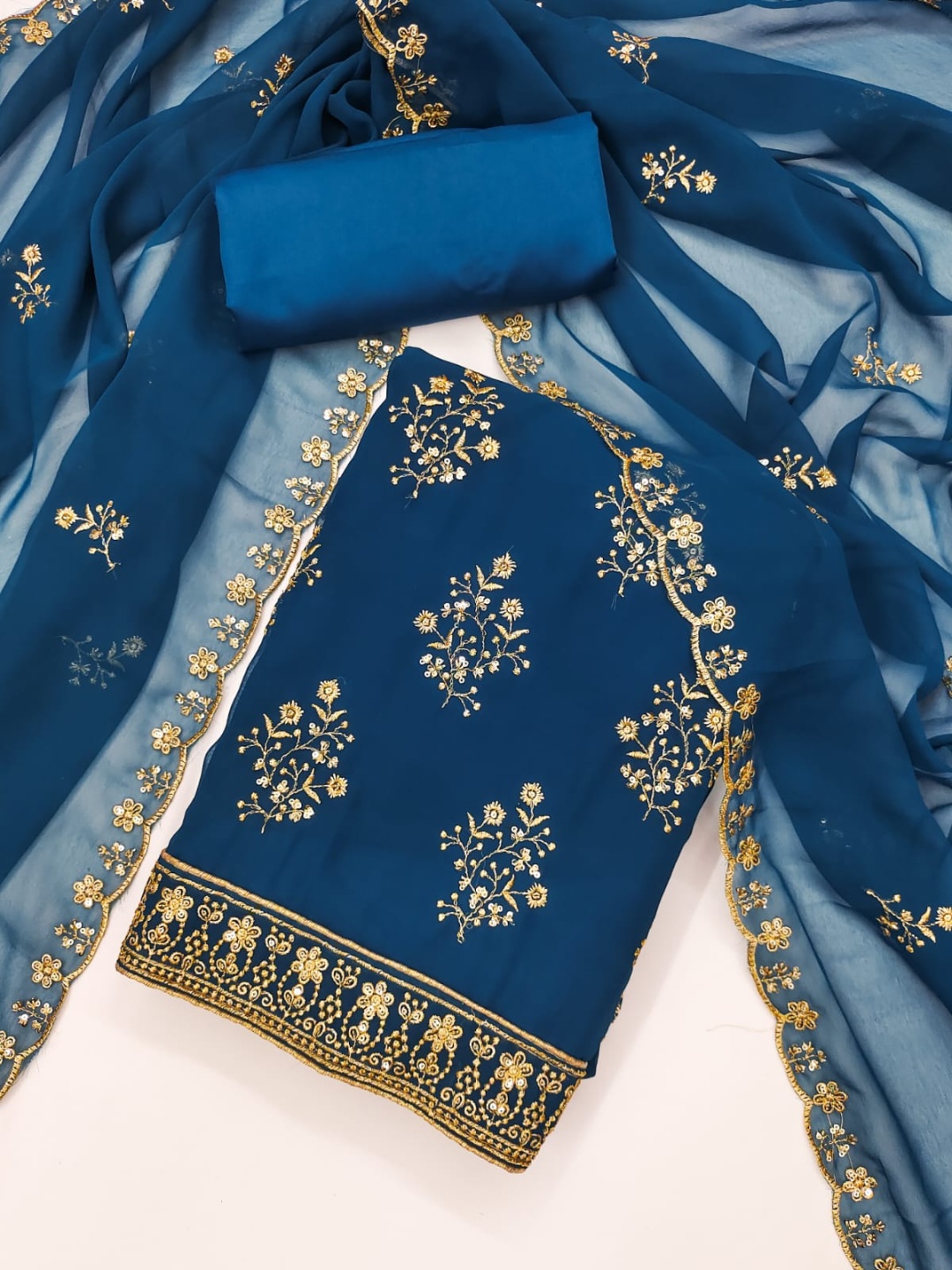 SWARNGANGA TEX Floral Embroidered Sequinned Georgette Unstitched Dress Material, Blue
SWARNGANGA TEX Floral Embroidered Sequinned Georgette Unstitched Dress Material, Blue