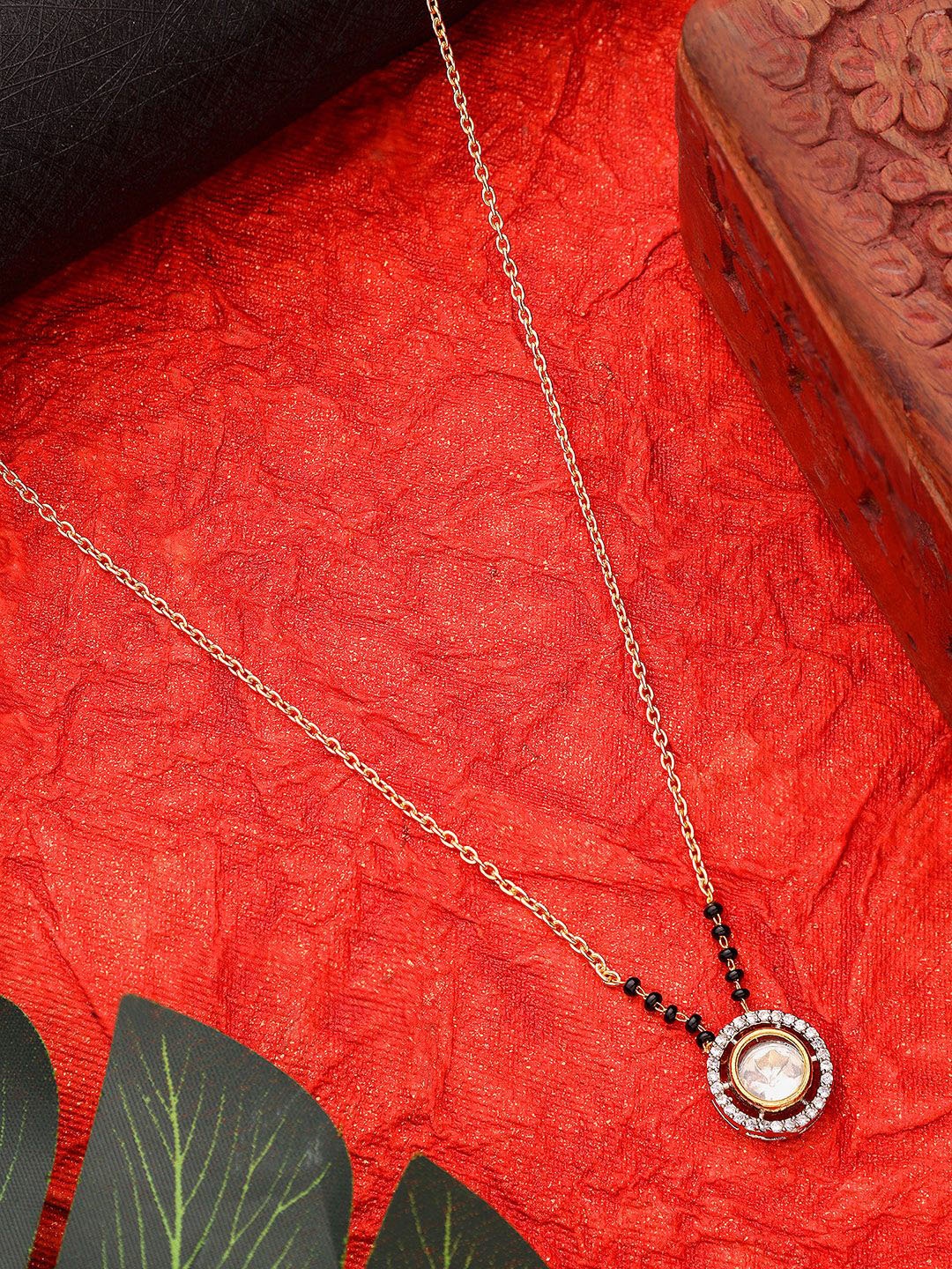 AARSEE OFFICIAL 22k Gold-Plated Artificial Stones Studded and Beaded Polki Mangalsutra
AARSEE OFFICIAL 22k Gold-Plated Artificial Stones Studded and Beaded Polki Mangalsutra