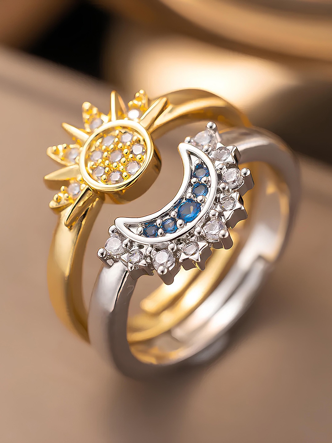 KARISHMA KREATIONS Set Of 2 Gold & Silver Plated Cubic Zirconia Studded Sun & Moon Rings
KARISHMA KREATIONS Set Of 2 Gold & Silver Plated Cubic Zirconia Studded Sun & Moon Rings