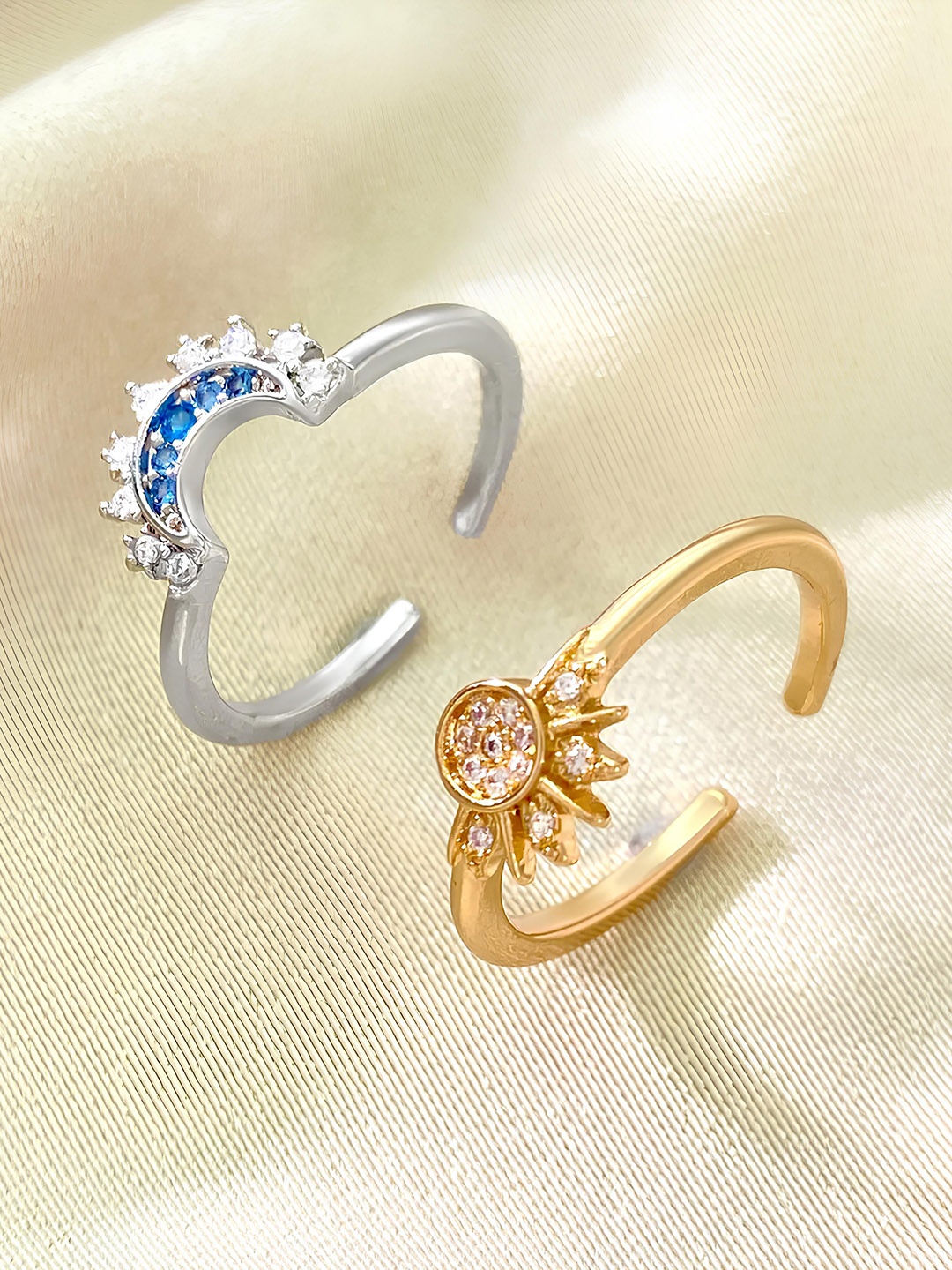 KARISHMA KREATIONS Set Of 2 Gold & Silver Plated Cubic Zirconia Studded Sun & Moon Rings
KARISHMA KREATIONS Set Of 2 Gold & Silver Plated Cubic Zirconia Studded Sun & Moon Rings