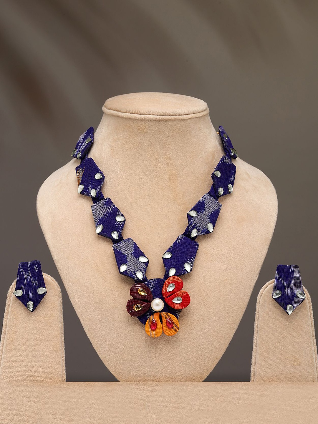 Exotic India Stone Studded Floral Design Handloom Sambalpuri Fabric Necklace Earrings Set, Blue
Exotic India Stone Studded Floral Design Handloom Sambalpuri Fabric Necklace Earrings Set, Blue