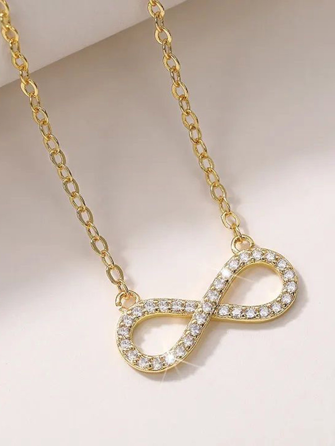 DIVASTRI Gold-Plated Cubic Zirconia Studded Stainless Steel Anti Tarnish Infinity Pendants
DIVASTRI Gold-Plated Cubic Zirconia Studded Stainless Steel Anti Tarnish Infinity Pendants