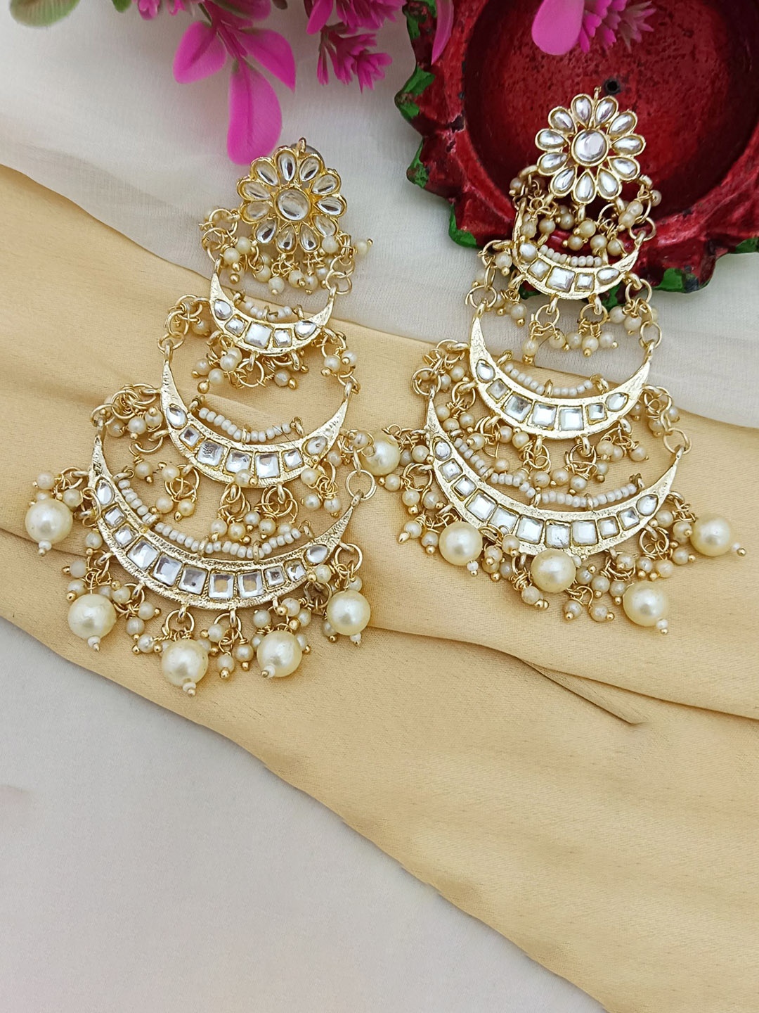 EVY Gold Plated Kundan Stones Studded and Beaded 3 Layered Crescent Shaped Chandbalis
EVY Gold Plated Kundan Stones Studded and Beaded 3 Layered Crescent Shaped Chandbalis