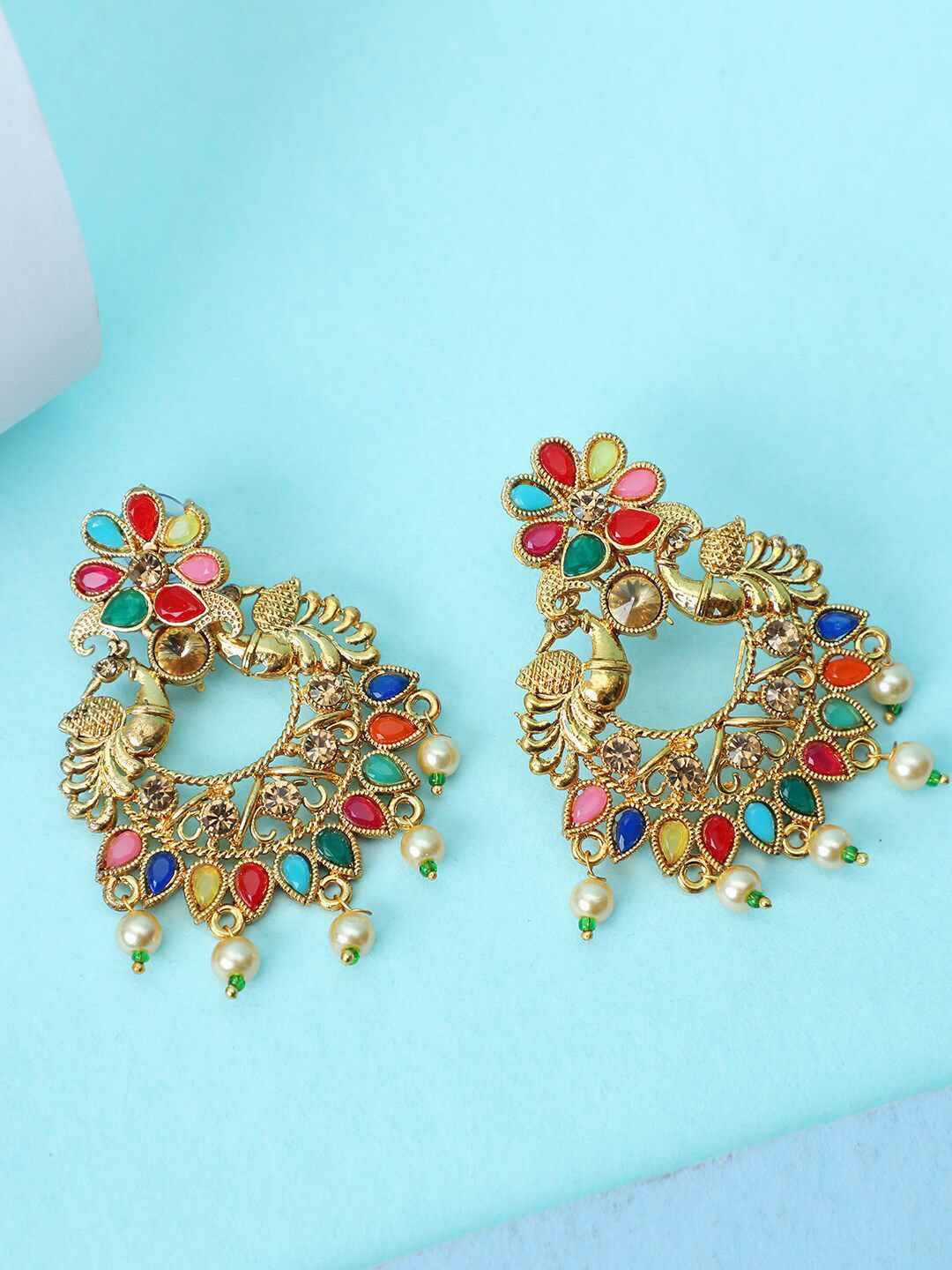Anouk Gold-Plated Artificial Stones and Beads Beaded Peacock Shaped Chandbalis Earrings
Anouk Gold-Plated Artificial Stones and Beads Beaded Peacock Shaped Chandbalis Earrings