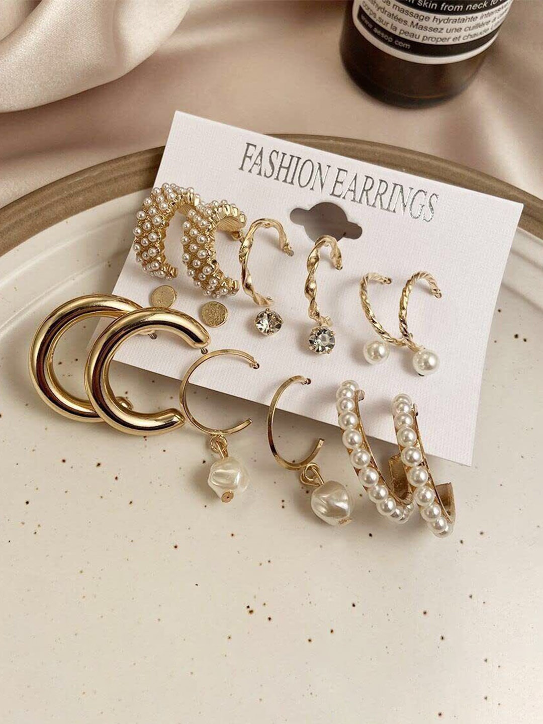 Celestique Set Of 9 Gold-Plated Pearls Beaded Contemporary Shaped Hoop Earrings
Celestique Set Of 9 Gold-Plated Pearls Beaded Contemporary Shaped Hoop Earrings