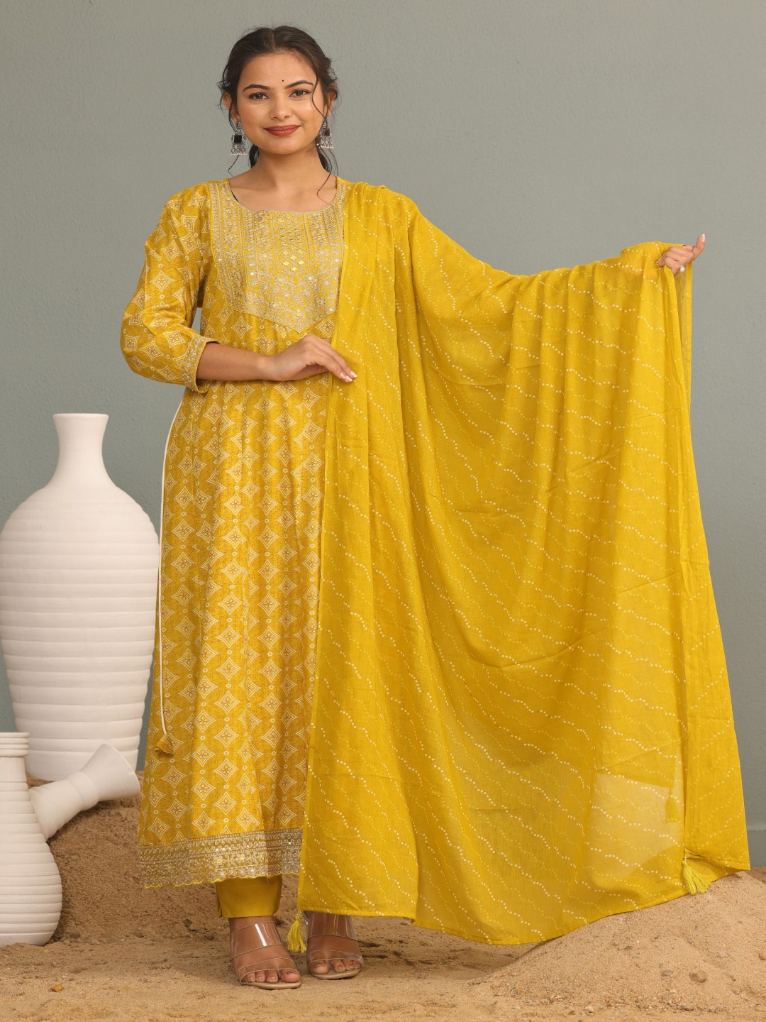 KALINI Ethnic Motifs Printed Zari Work Embellished Anarkali Kurta With Trouser & Dupatta, Mustard
KALINI Ethnic Motifs Printed Zari Work Embellished Anarkali Kurta With Trouser & Dupatta, Mustard