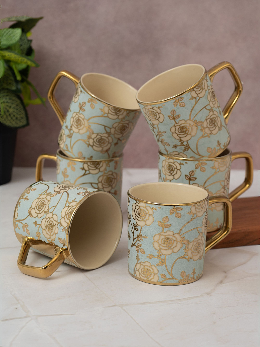 CLAY CRAFT Blue & Gold-Toned Floral Printed Ceramic Glossy Coffee Mug Set Of 6-215 Ml Each
CLAY CRAFT Blue & Gold-Toned Floral Printed Ceramic Glossy Coffee Mug Set Of 6-215 Ml Each