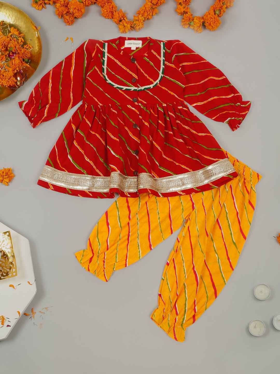 LITTLE GINNIE Girls Leheriya Printed Layered Gotta Patti Kurti with Salwar, Yellow
LITTLE GINNIE Girls Leheriya Printed Layered Gotta Patti Kurti with Salwar, Yellow