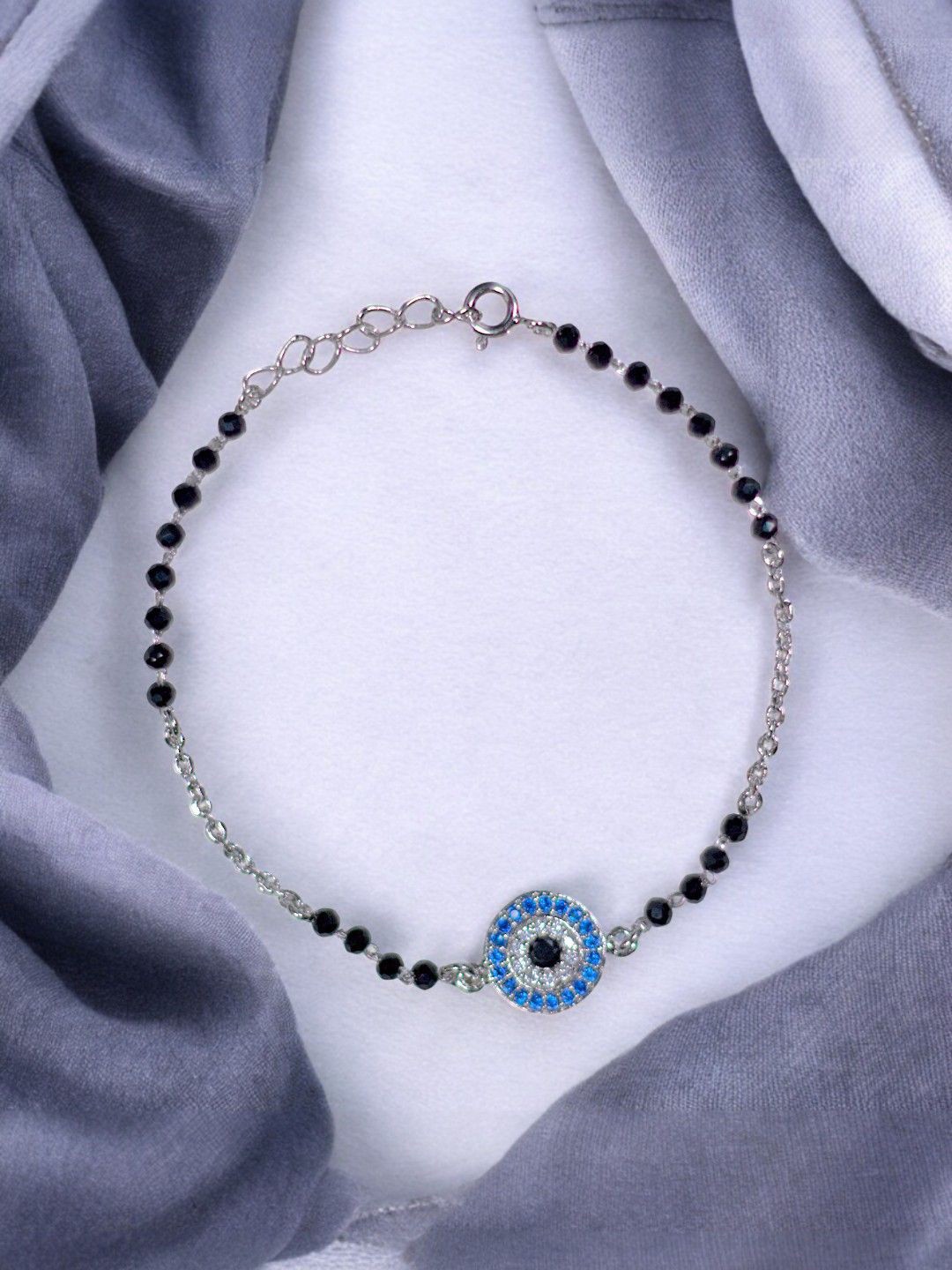 Taraash 925 Sterling Silver Stone Studded & Beaded Evil Eye Mangalsutra Bracelet
Taraash 925 Sterling Silver Stone Studded & Beaded Evil Eye Mangalsutra Bracelet