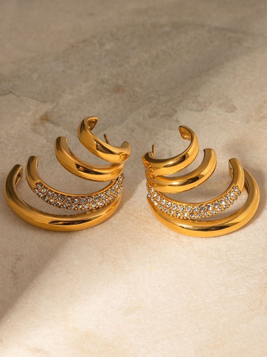 KAORI BY SHREYA AGARWAL Gold-Plated Cubic Zirconia Studded Contemporary Half Hoop Earrings
KAORI BY SHREYA AGARWAL Gold-Plated Cubic Zirconia Studded Contemporary Half Hoop Earrings