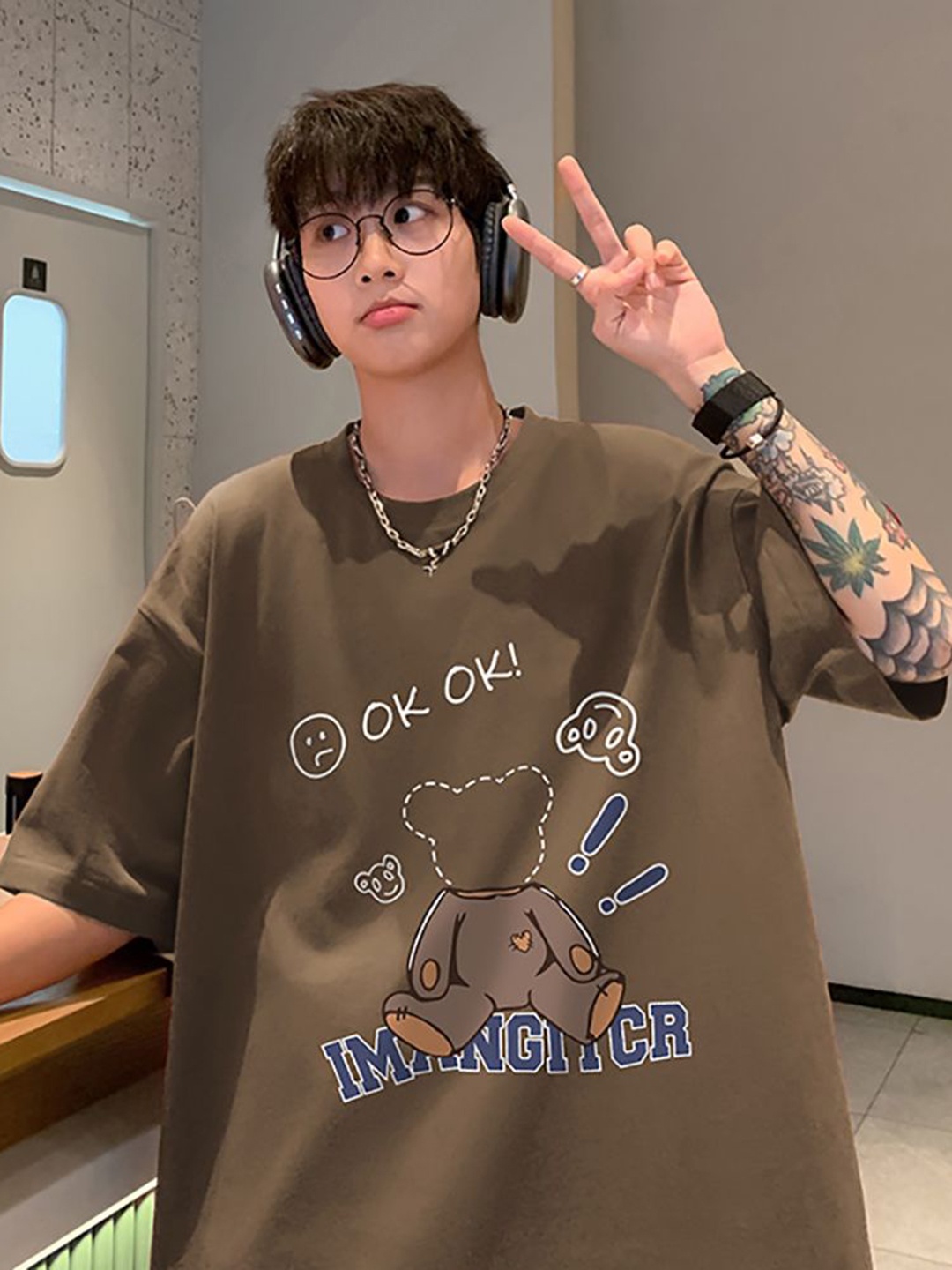 StyleCast x Revolte Men Graphic Printed Round Neck Cotton Oversized T-shirt, Coffee brown
StyleCast x Revolte Men Graphic Printed Round Neck Cotton Oversized T-shirt, Coffee brown