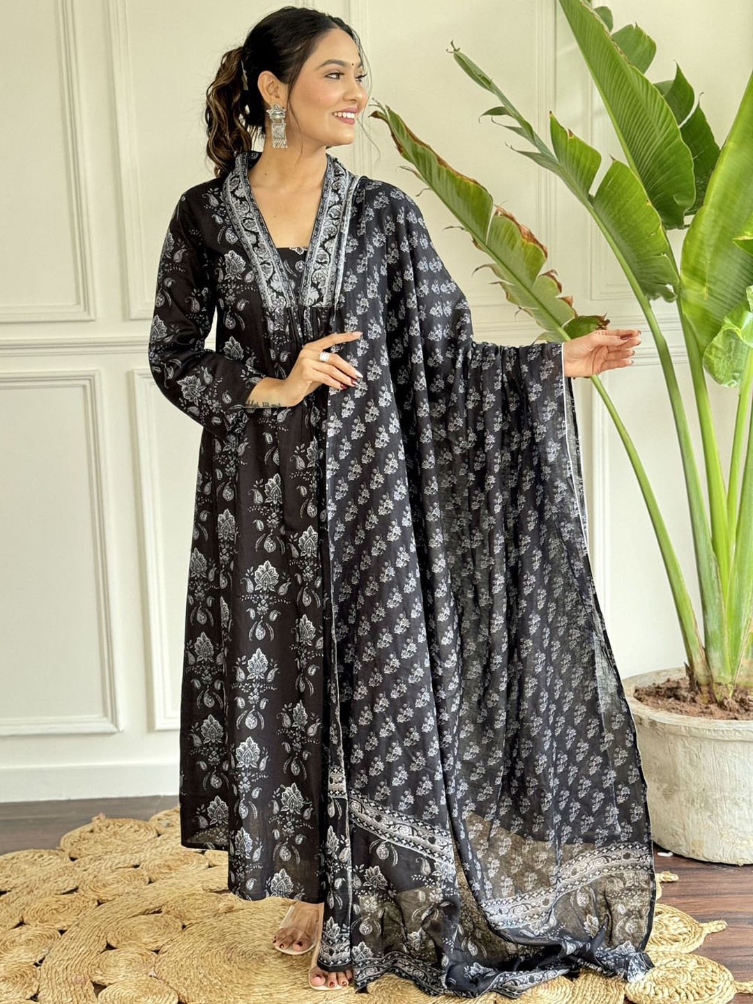 SHIJILA Floral Printed Pleated V-Neck Pure Cotton A-Line Kurta With Trousers And Dupatta, Black
SHIJILA Floral Printed Pleated V-Neck Pure Cotton A-Line Kurta With Trousers And Dupatta, Black