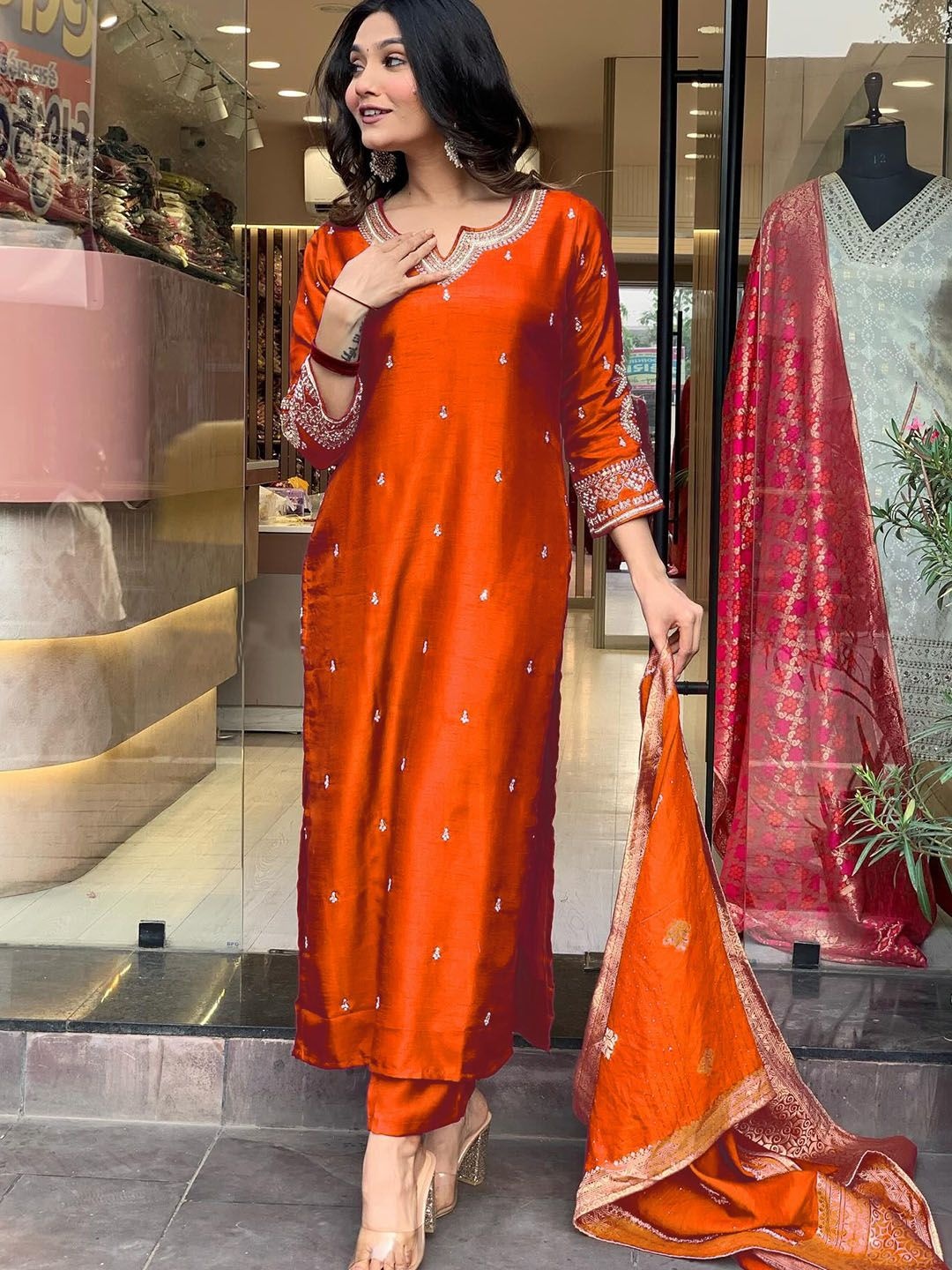 BLACK SCISSOR Floral Embroidered Notch-Neck Straight Kurta With Trousers And Dupatta, Orange
BLACK SCISSOR Floral Embroidered Notch-Neck Straight Kurta With Trousers And Dupatta, Orange