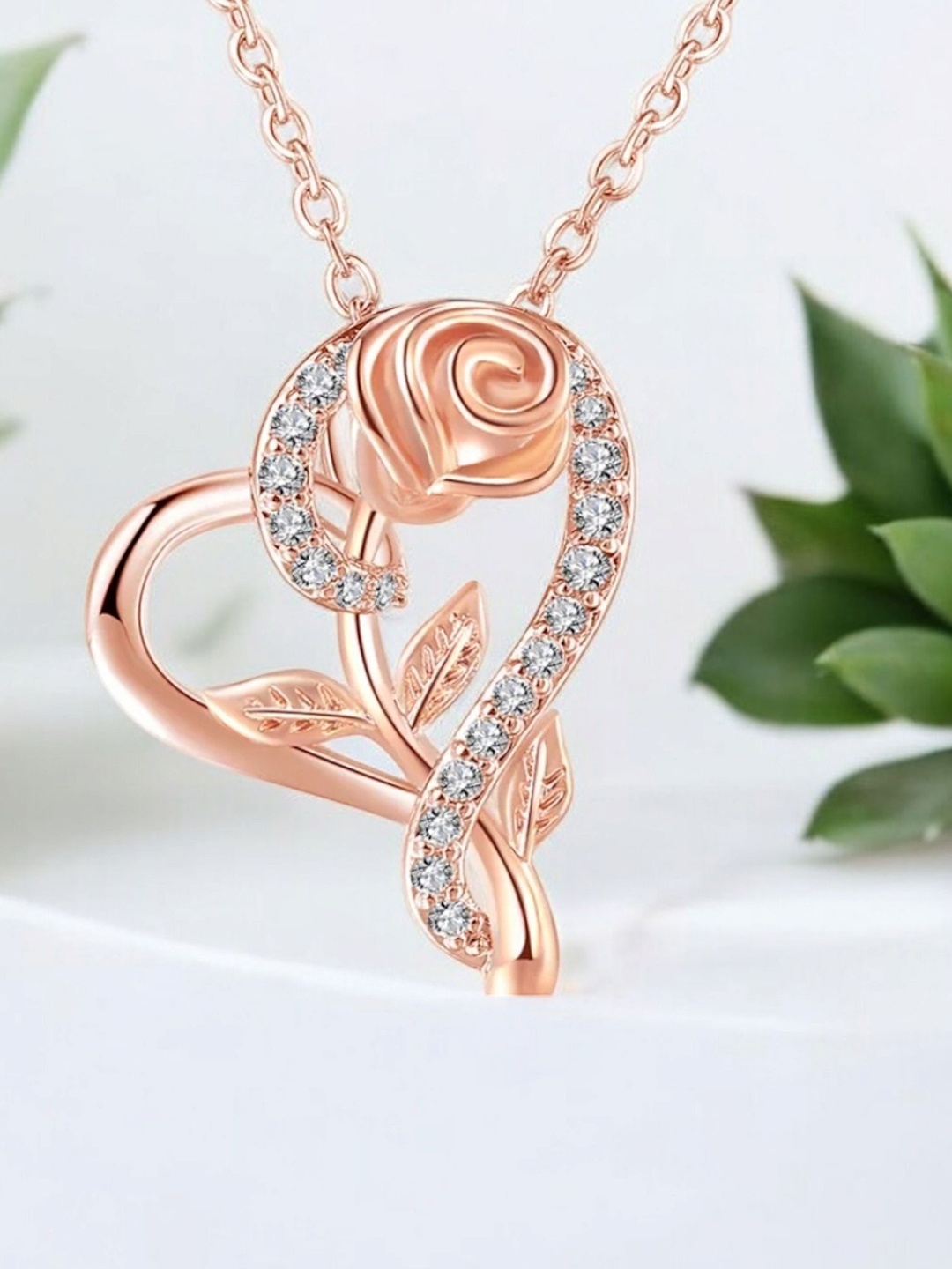 Nilu's Collection Rose Gold-Plated Cubic Zirconia Studded Heart Shaped Pendant With Chain
Nilu's Collection Rose Gold-Plated Cubic Zirconia Studded Heart Shaped Pendant With Chain