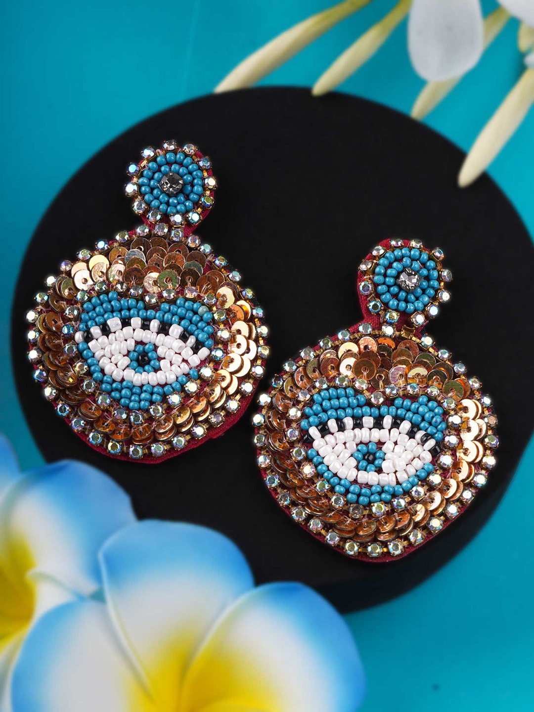 Sangria Blue Gold-Plated Artificial Stones Studded Oval Shaped Drop Earrings
Sangria Blue Gold-Plated Artificial Stones Studded Oval Shaped Drop Earrings