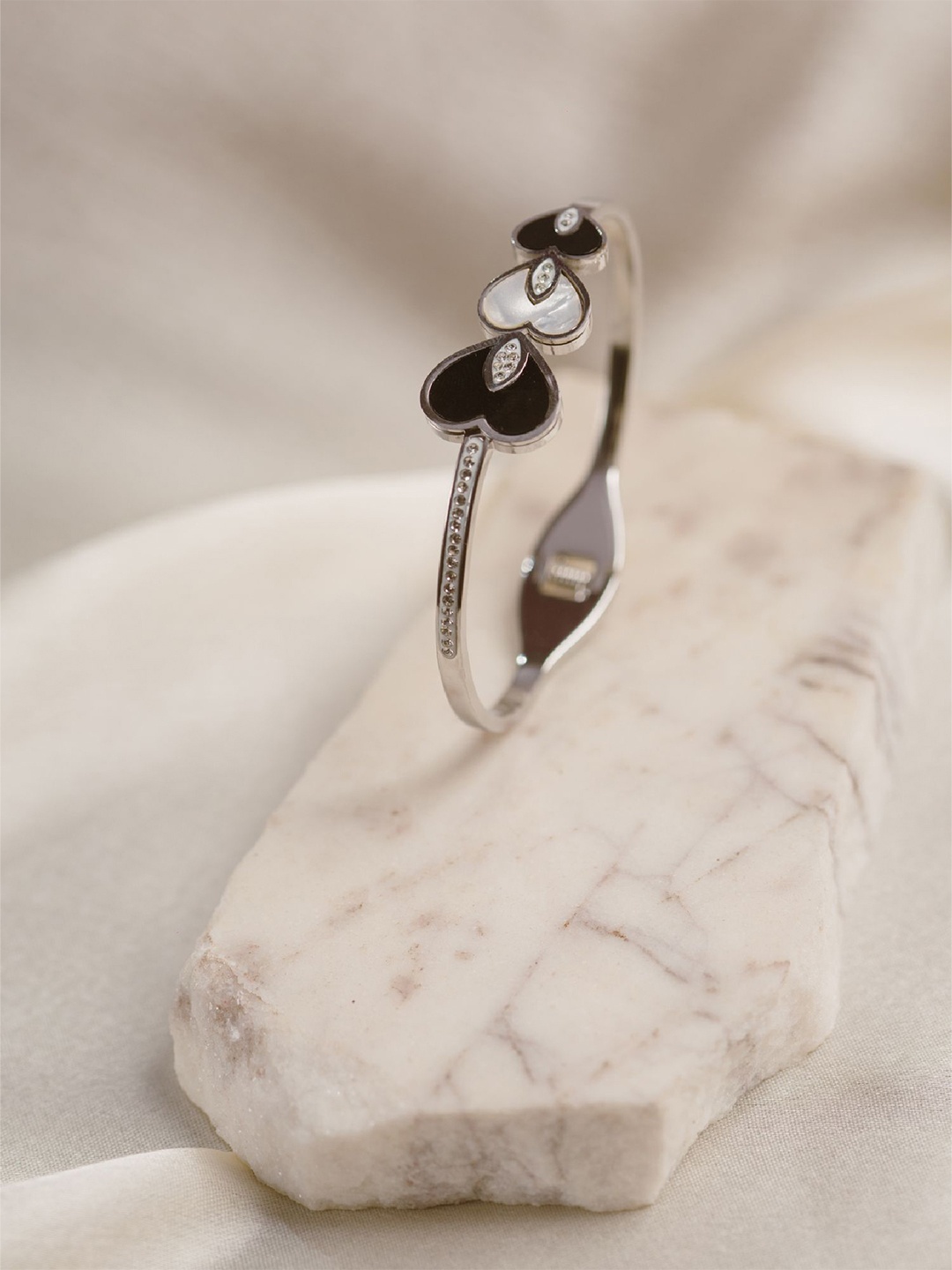 ARTKLIM Silver-Plated Artificial Stones Studded Elegant Heart Design Bangle-Style Bracelet
ARTKLIM Silver-Plated Artificial Stones Studded Elegant Heart Design Bangle-Style Bracelet