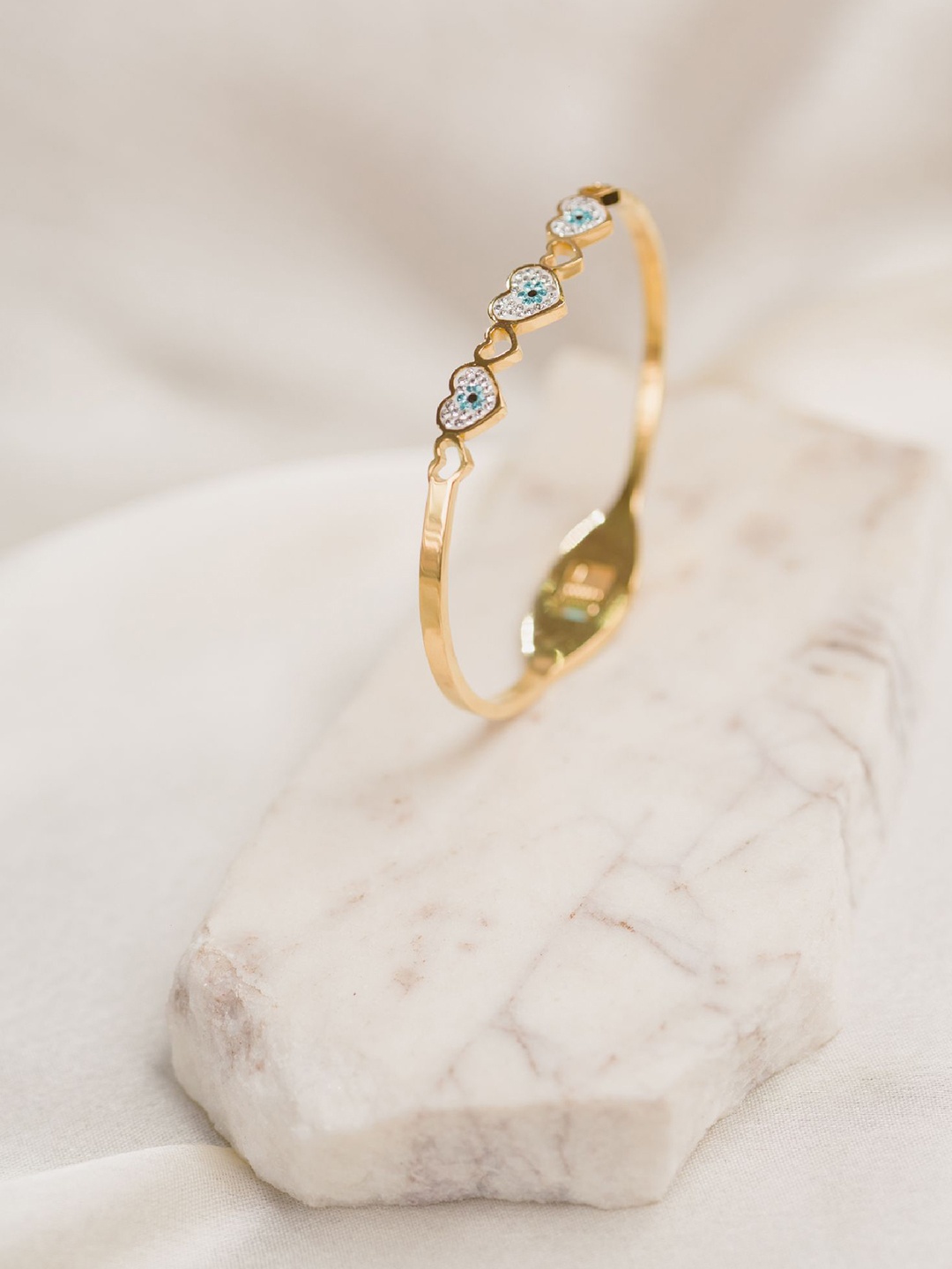 ARTKLIM Gold-Plated Artificial Stones Studded Evil Eye In Heart Bangle-Style Bracelet
ARTKLIM Gold-Plated Artificial Stones Studded Evil Eye In Heart Bangle-Style Bracelet