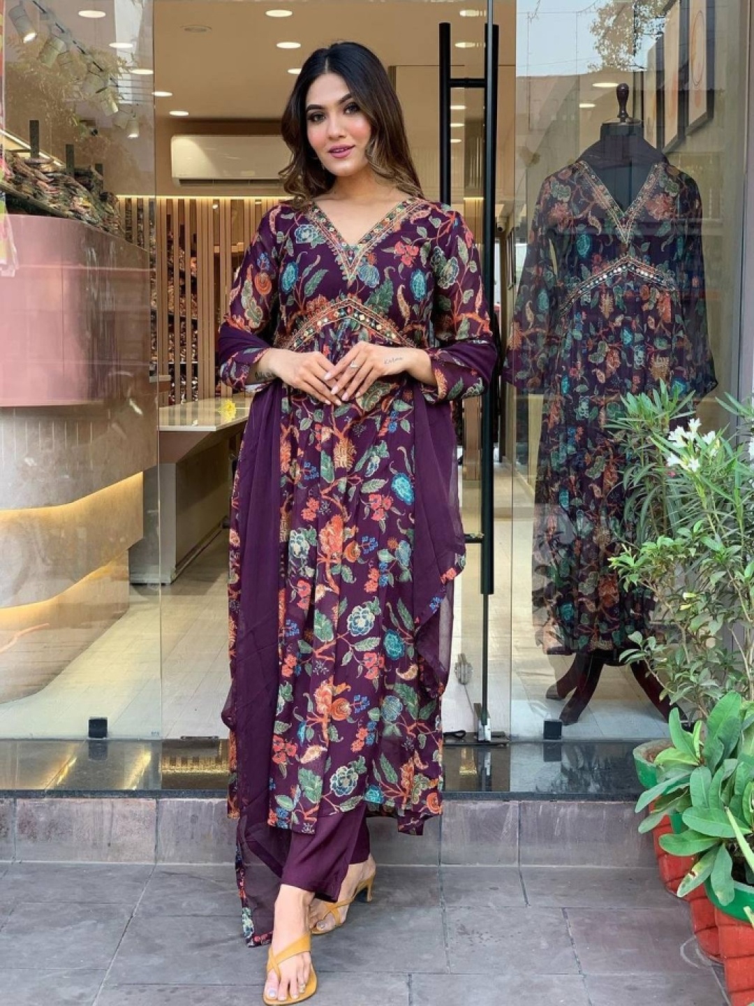 KALINI Floral Printed V-Neck Thread Work Empire A-Line Kurta With Trousers & Dupatta, Purple
KALINI Floral Printed V-Neck Thread Work Empire A-Line Kurta With Trousers & Dupatta, Purple
