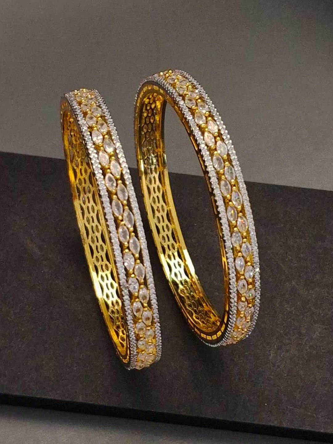 Zevarly Set Of 2 Gold-Plated American Diamond & Cubic Zirconia Stone-Studded Bangles
Zevarly Set Of 2 Gold-Plated American Diamond & Cubic Zirconia Stone-Studded Bangles