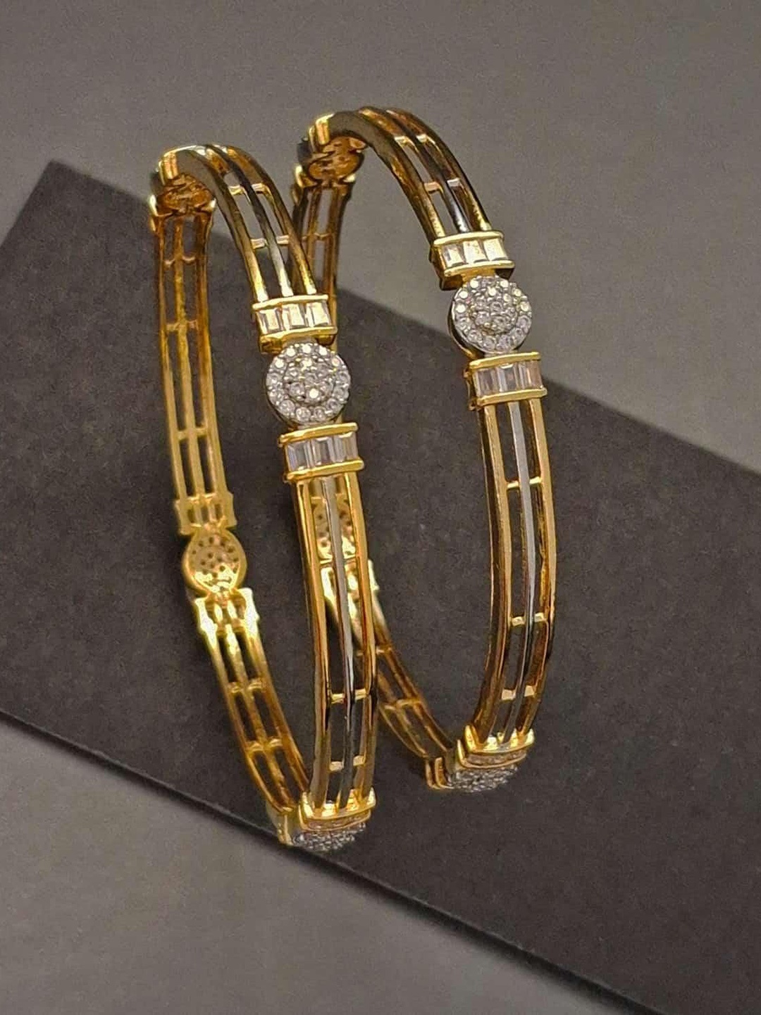 Zevarly Set Of 2 Gold-Plated American Diamond & Cubic Zirconia Stone-Studded Bangles
Zevarly Set Of 2 Gold-Plated American Diamond & Cubic Zirconia Stone-Studded Bangles