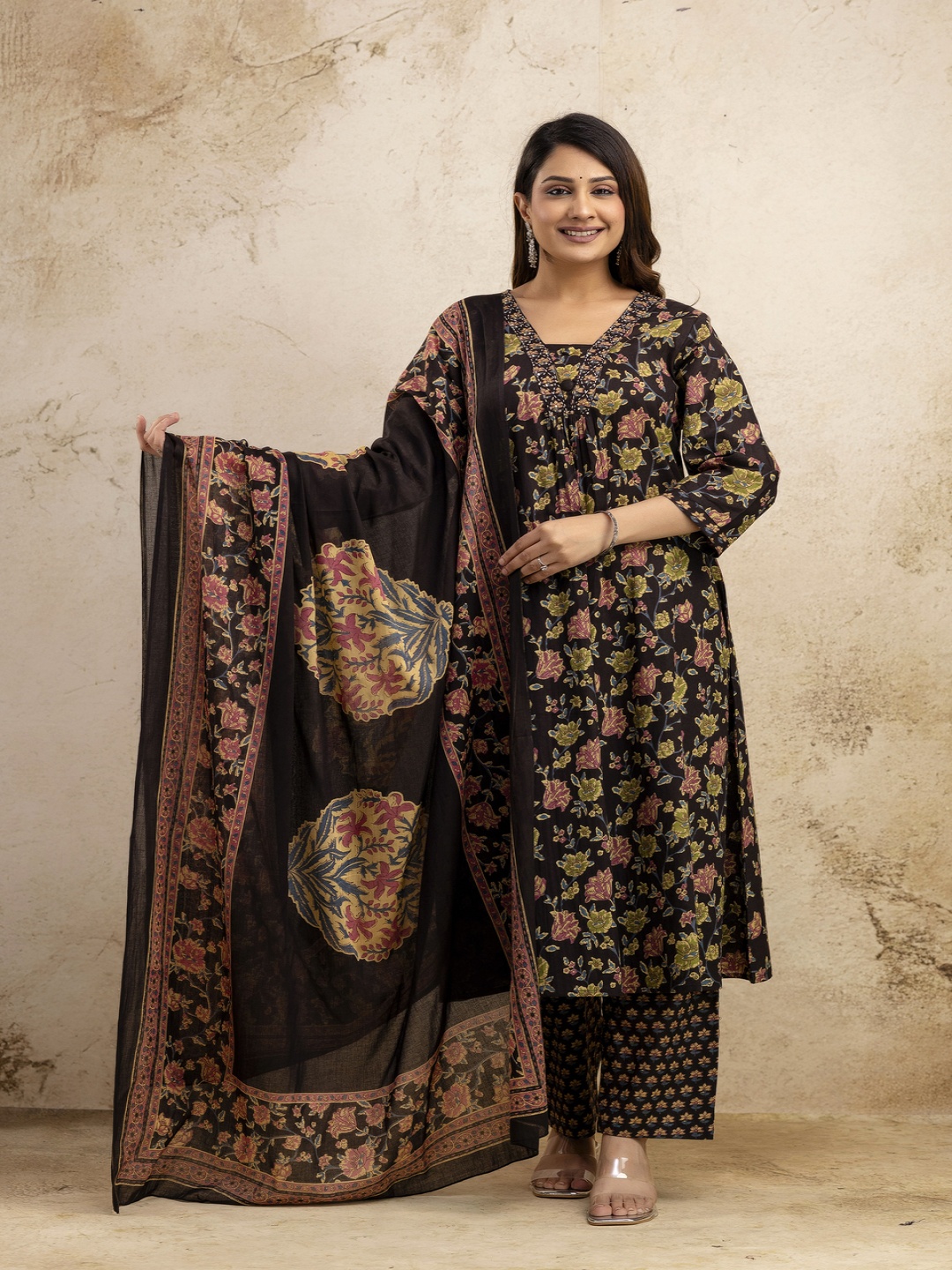 NISHIRE Floral Printed V-Neck Pleated Pure Cotton A-Line Kurta With Trouser & Dupatta, Black
NISHIRE Floral Printed V-Neck Pleated Pure Cotton A-Line Kurta With Trouser & Dupatta, Black